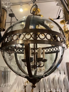 Pair of French Bronze Globe Lanterns. Sold Individually