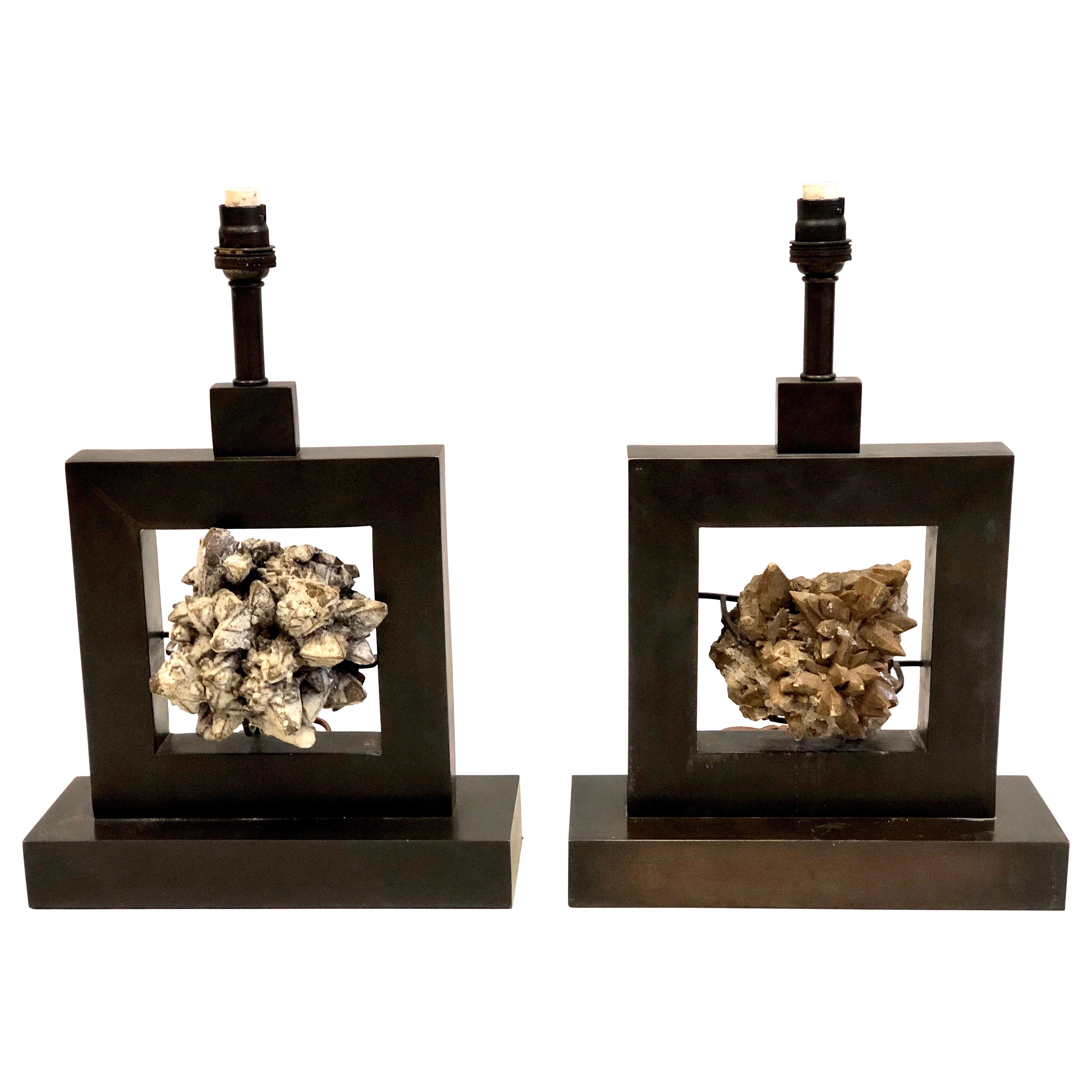 Elegant, rare and timeless pair of mineral crystal geode table by the renowned French mid-20th century interior designer and architect, Marc Duplantier. The raw rock crystal is delicately set in sober, handmade, bronzed wrought iron table lamp bases