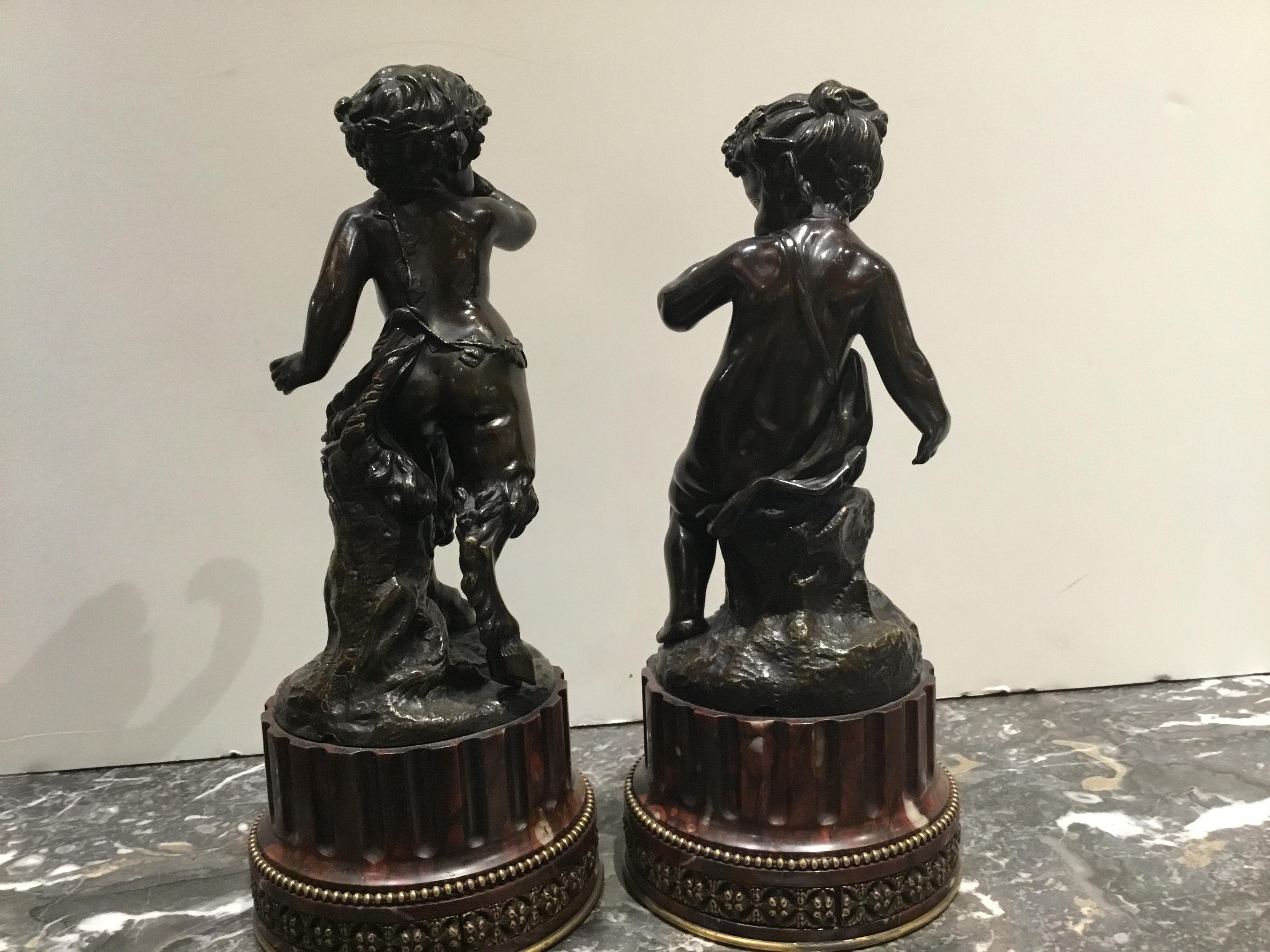 Pair of exceptional French bronze sculptures of a Nympth and Satyr both signed in
The bronze “Clodion” (Claude Michael Clodion) the sculptures set on rouge marble bases.