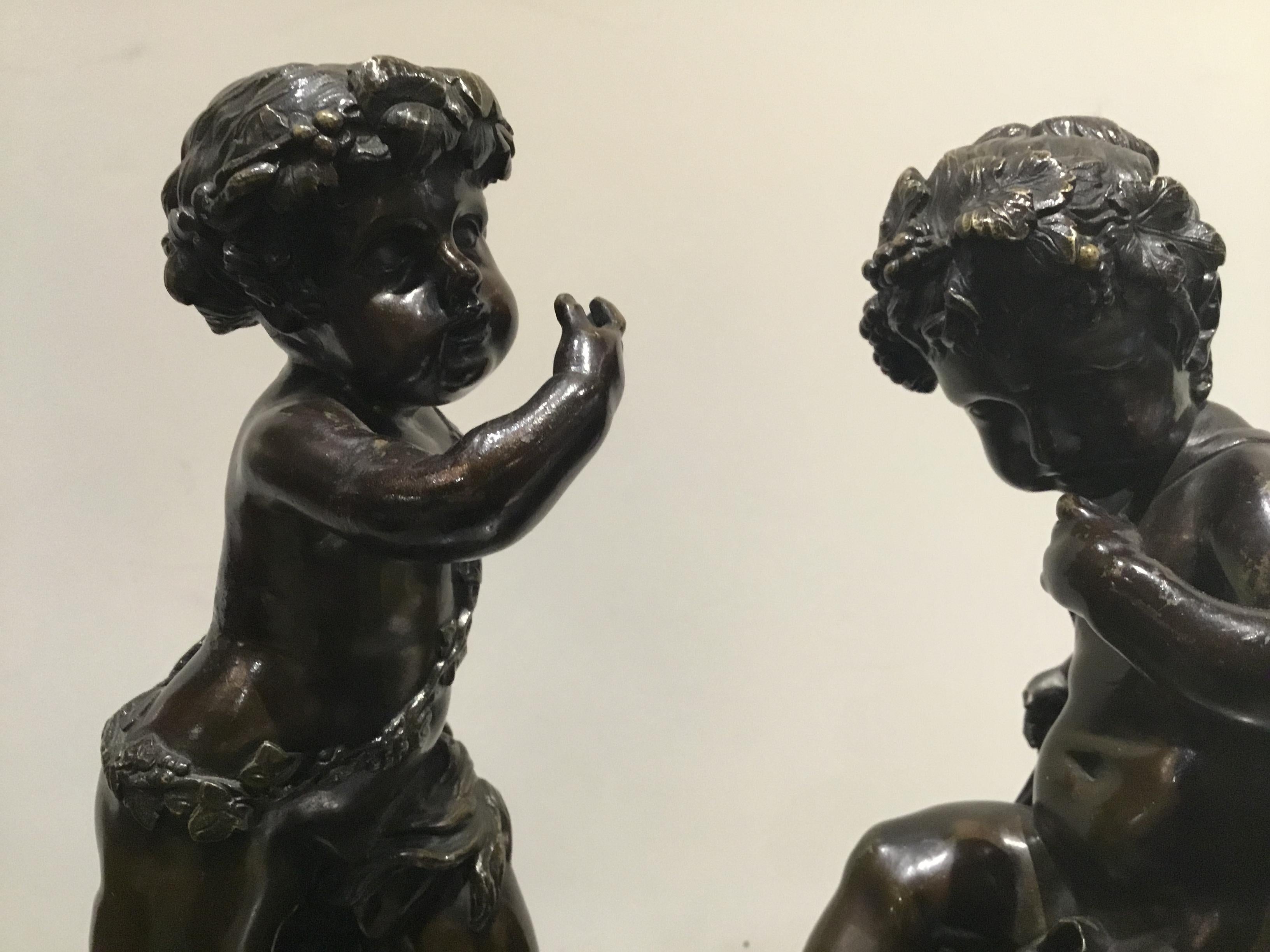 Coppia di sculture francesi in bronzo raffiguranti una ninfa e un satiro, firmate 