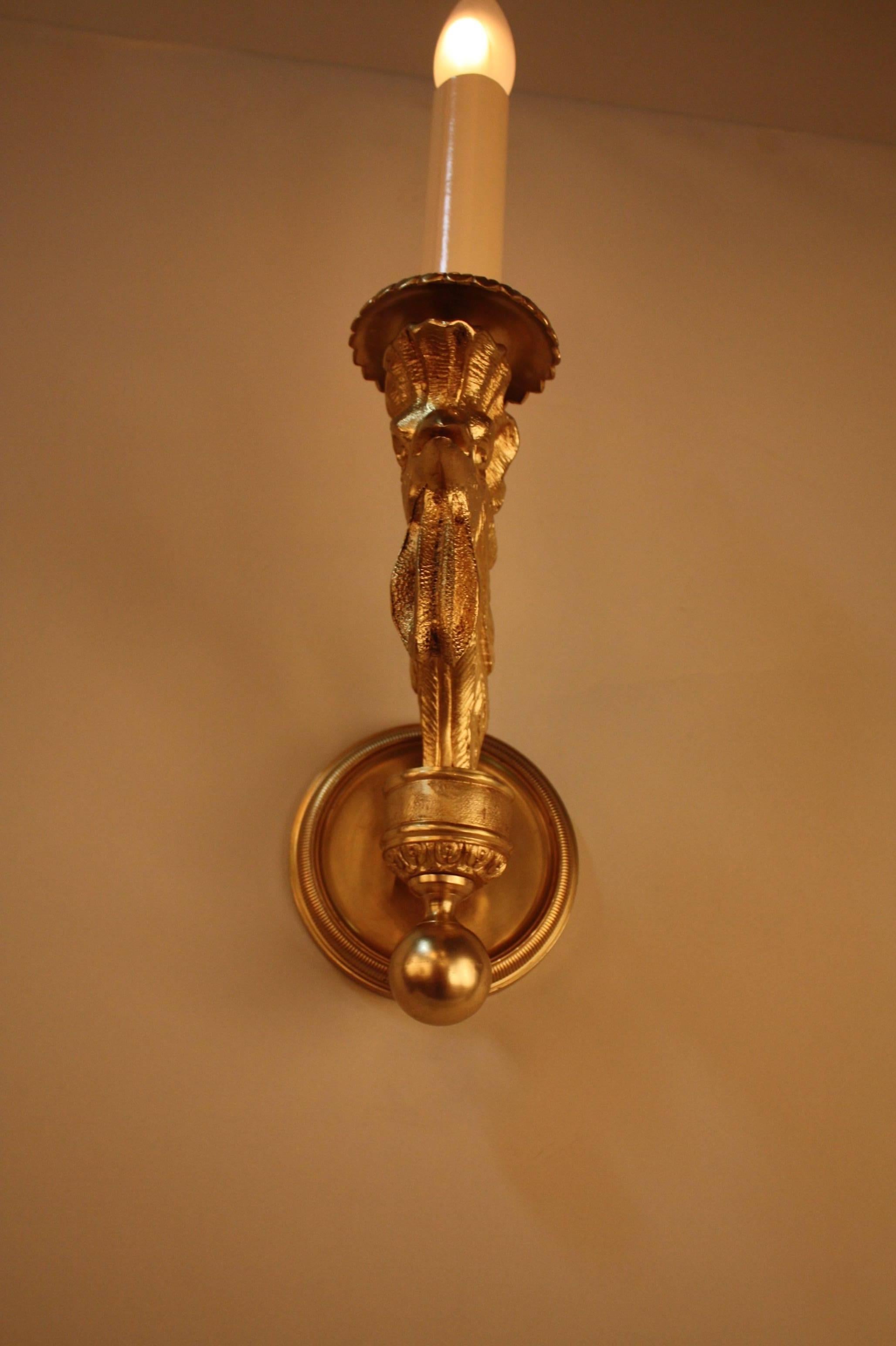 Fabulous pair of single light wall sconces with beautiful bronze sculptured rooster head arm.