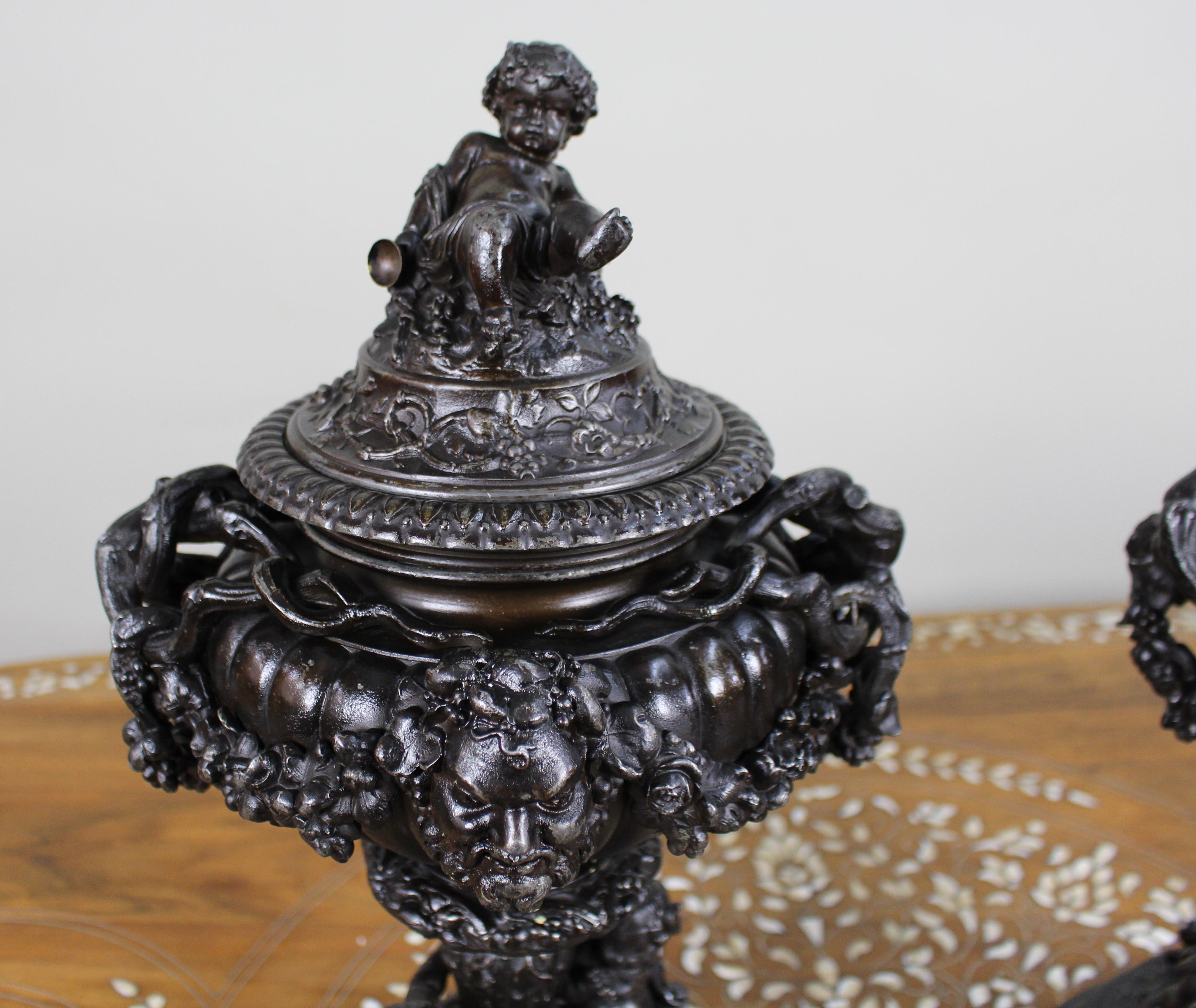 Pair of French Bronzed Spelter Urns with Bacchic Masks and Putti, Circa 1880 For Sale 1