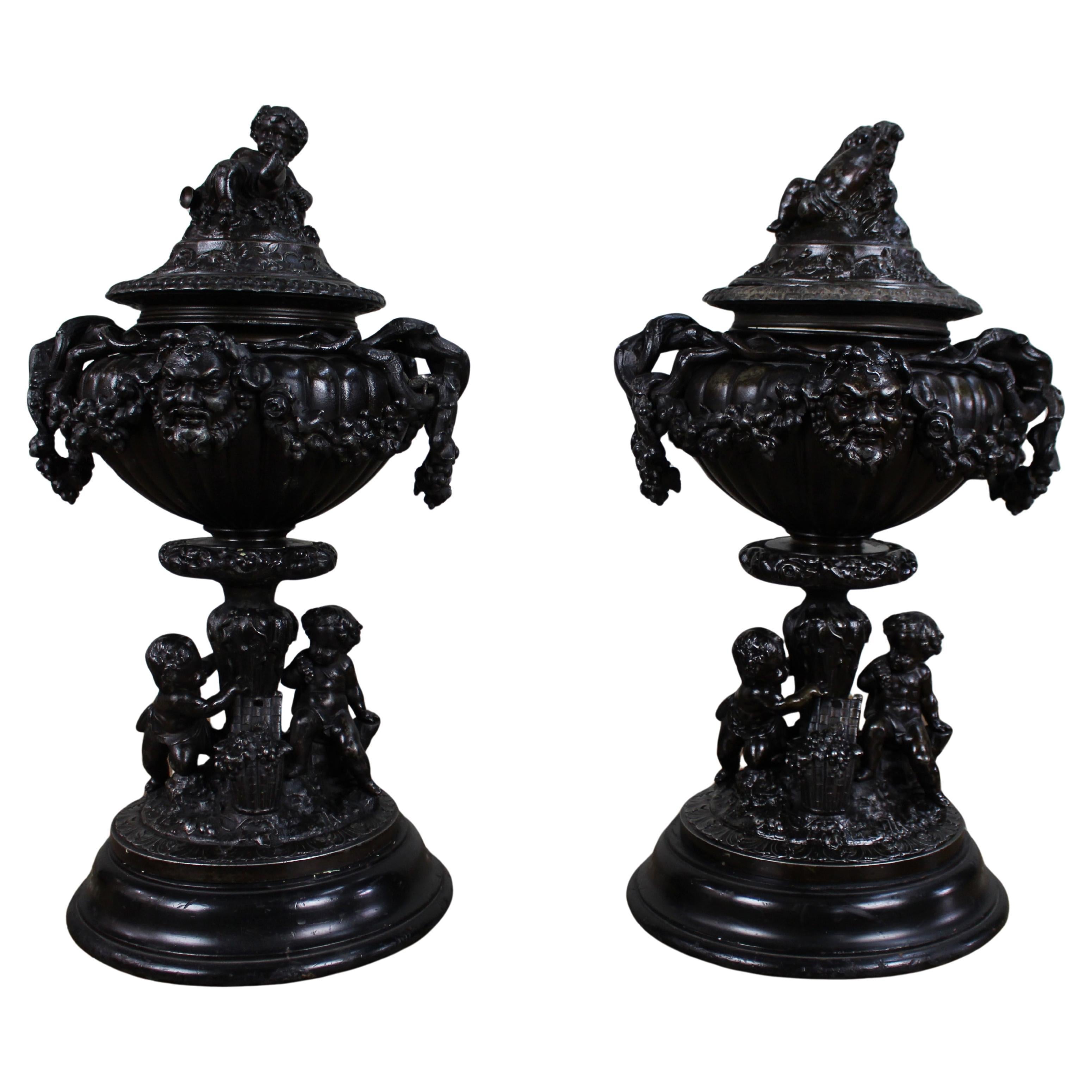 Pair of French Bronzed Spelter Urns with Bacchic Masks and Putti, Circa 1880 For Sale