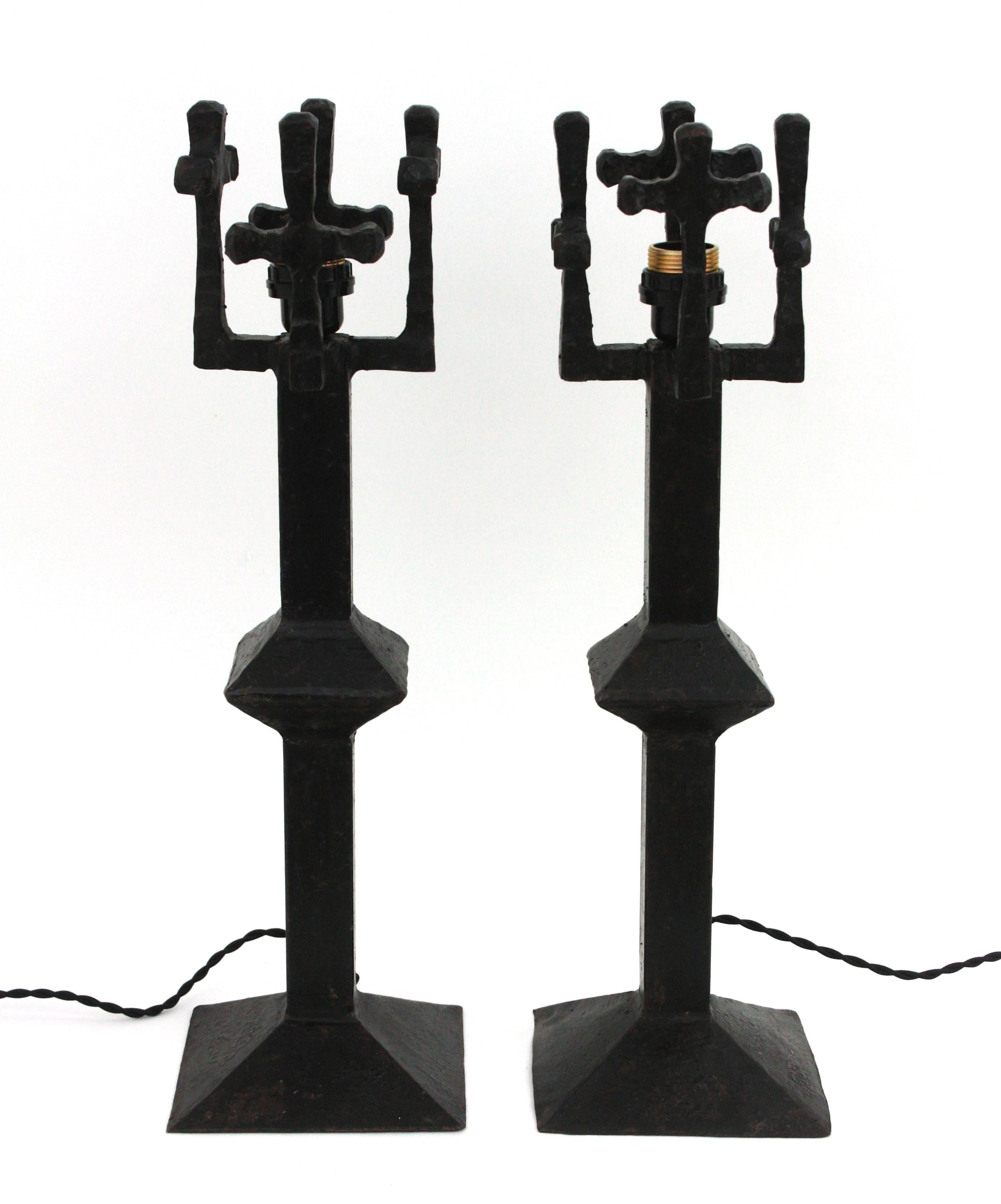 Pair of Iron Brutalist Table Lamps, France, 1950s.
Hand forged Iron table lamps with cross details on the top and squared bases.
Solid structure and beautiful construction.
To be used with or without lampshades-choosing an eye-catching bulb as shown