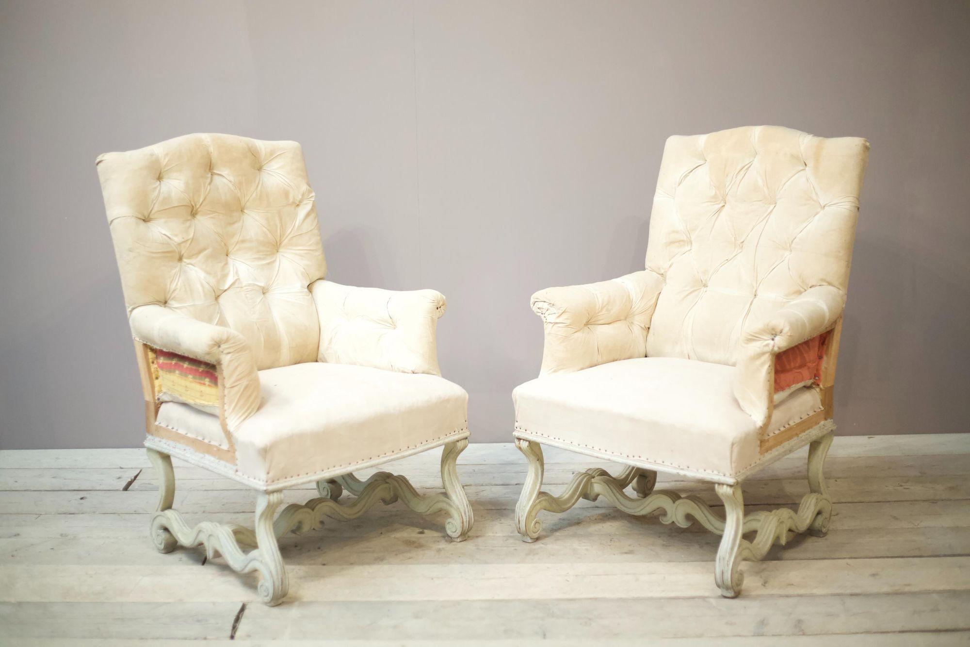 These are a stunning pair of 19th century French armchairs with a very nicely carved painted frame and shaped back. The size of these is also impressive making the chairs a great decorative addition to a room. The paint isn't original but not new