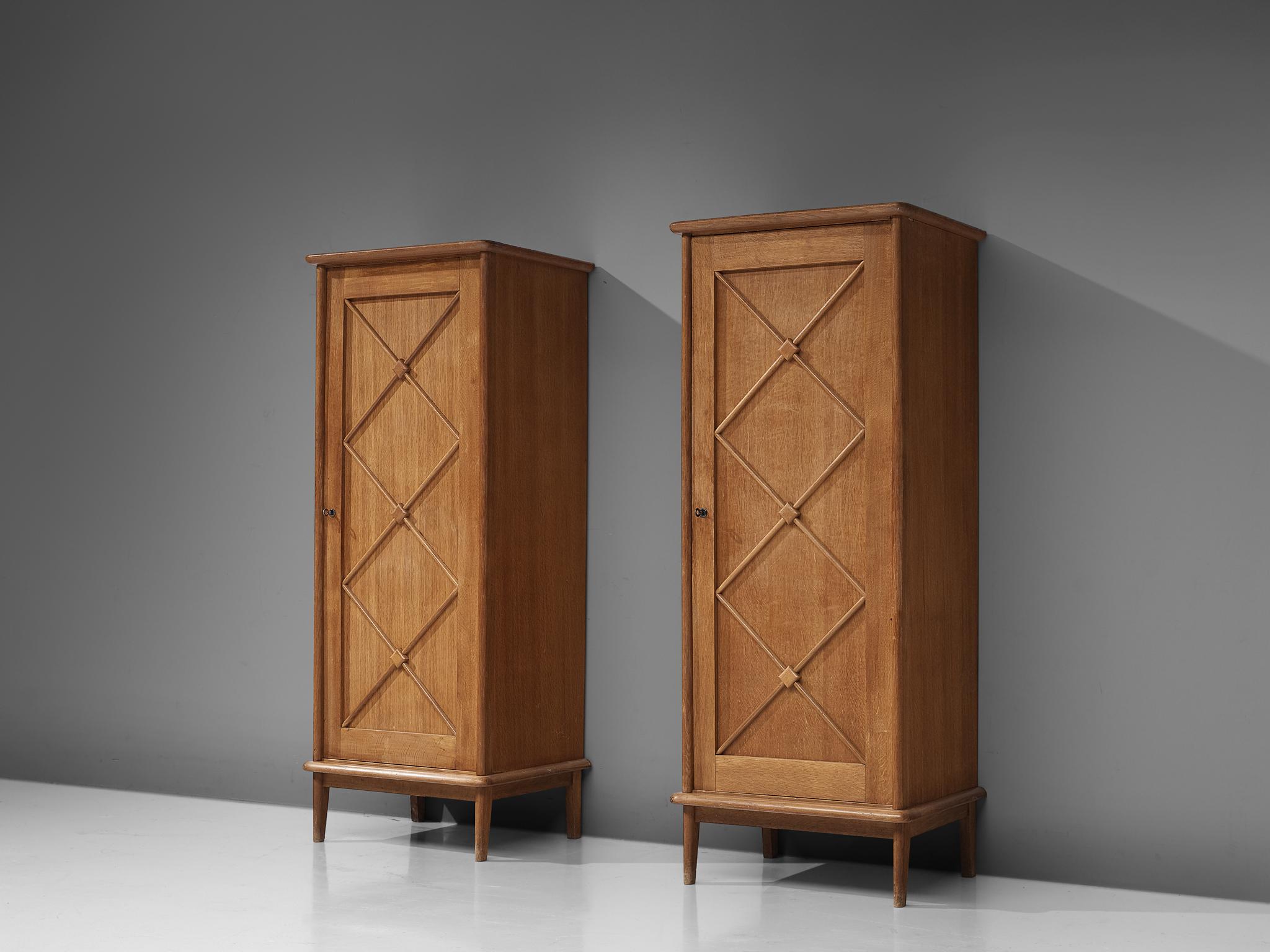 Pair of cabinets, oak, France, 1960s

Elegant case pieces in oak that features geometric details in the doors. The high board with one door is lifted from the ground by slim, conical legs that give the solid looking body a more airy appearance. The