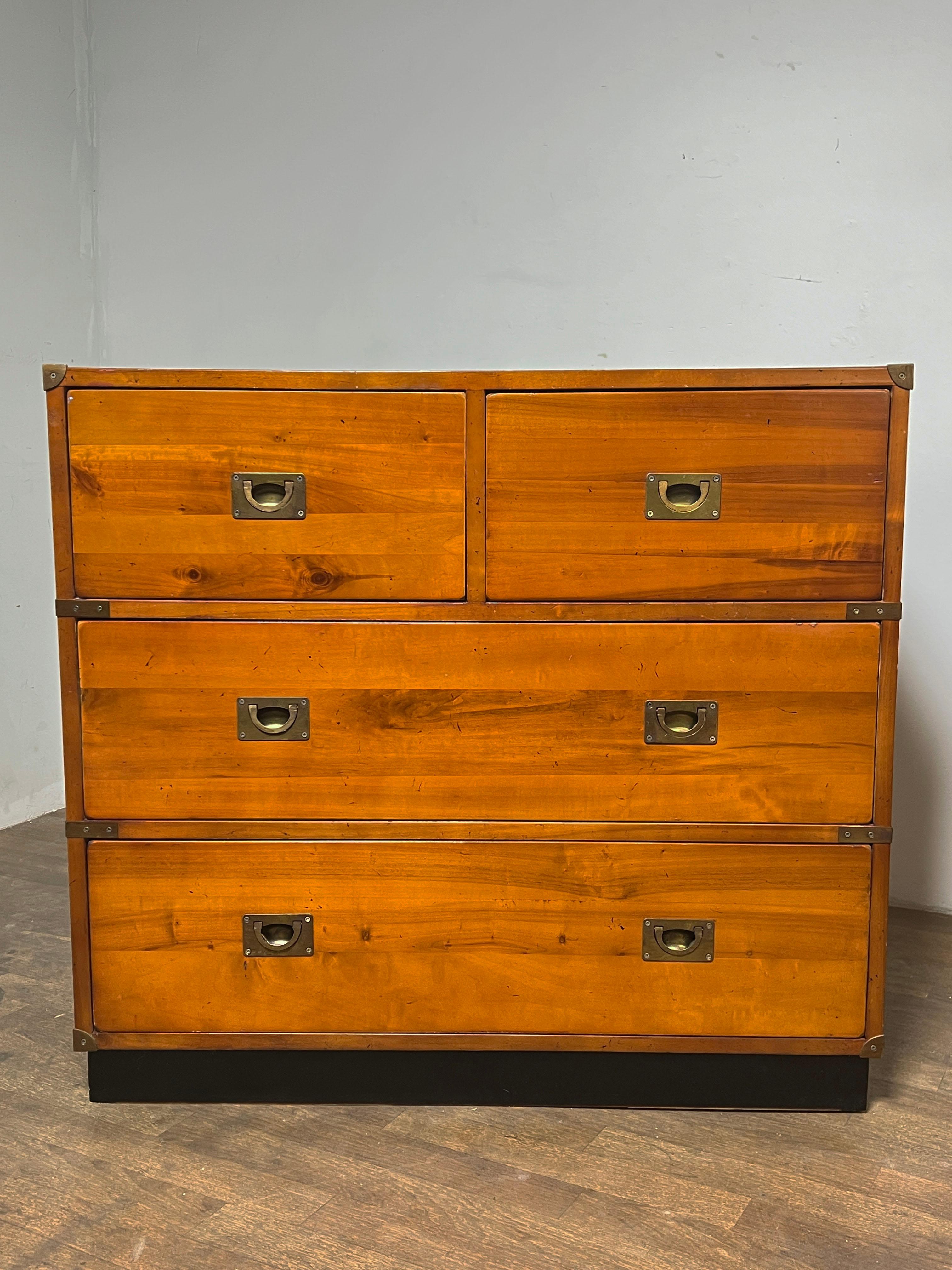 A matched pair of vintage campaign (cabinet de voyages) chests in amber toned solid pine with brass hardware, made in France, ca. 1970s. 