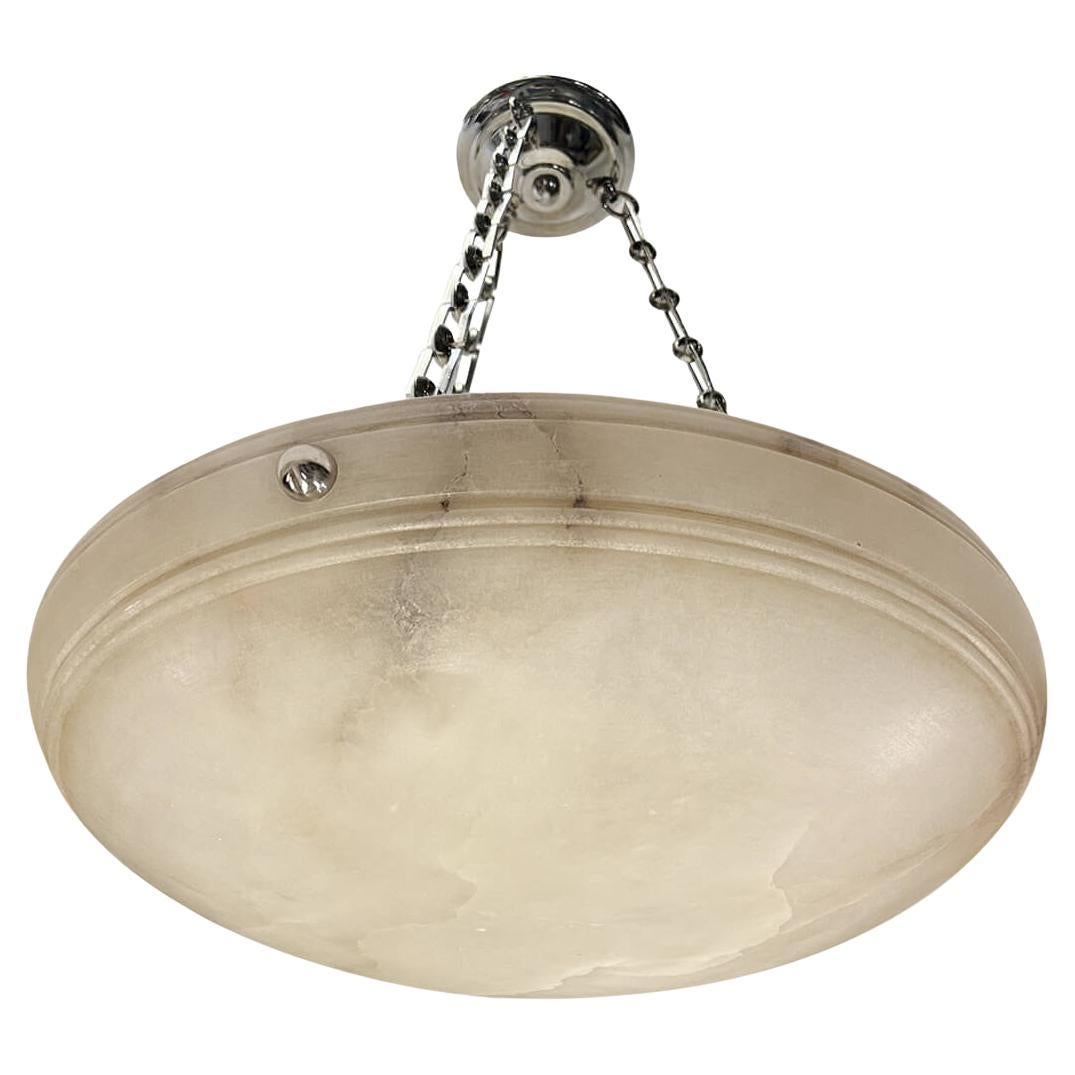 Pair of circa 1950's French carved alabaster light fixtures with 3 Edison interior lights. Sold individually.
Measurements:
Diameter: 24