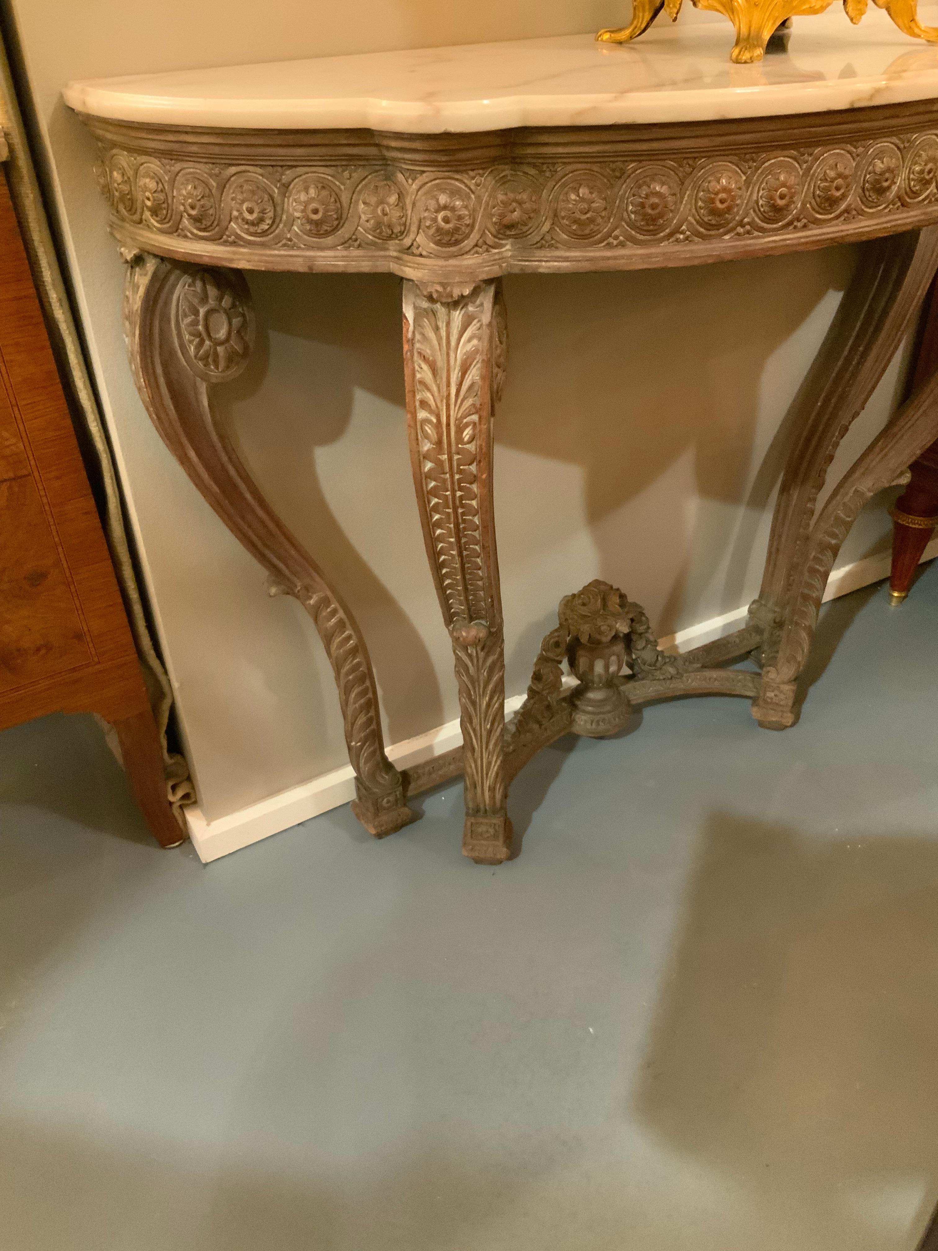 Fine pair with good carving and in great condition 
Carved with a circular floret around the outer perimeter 
An urn filled with flowers is carved at the base
