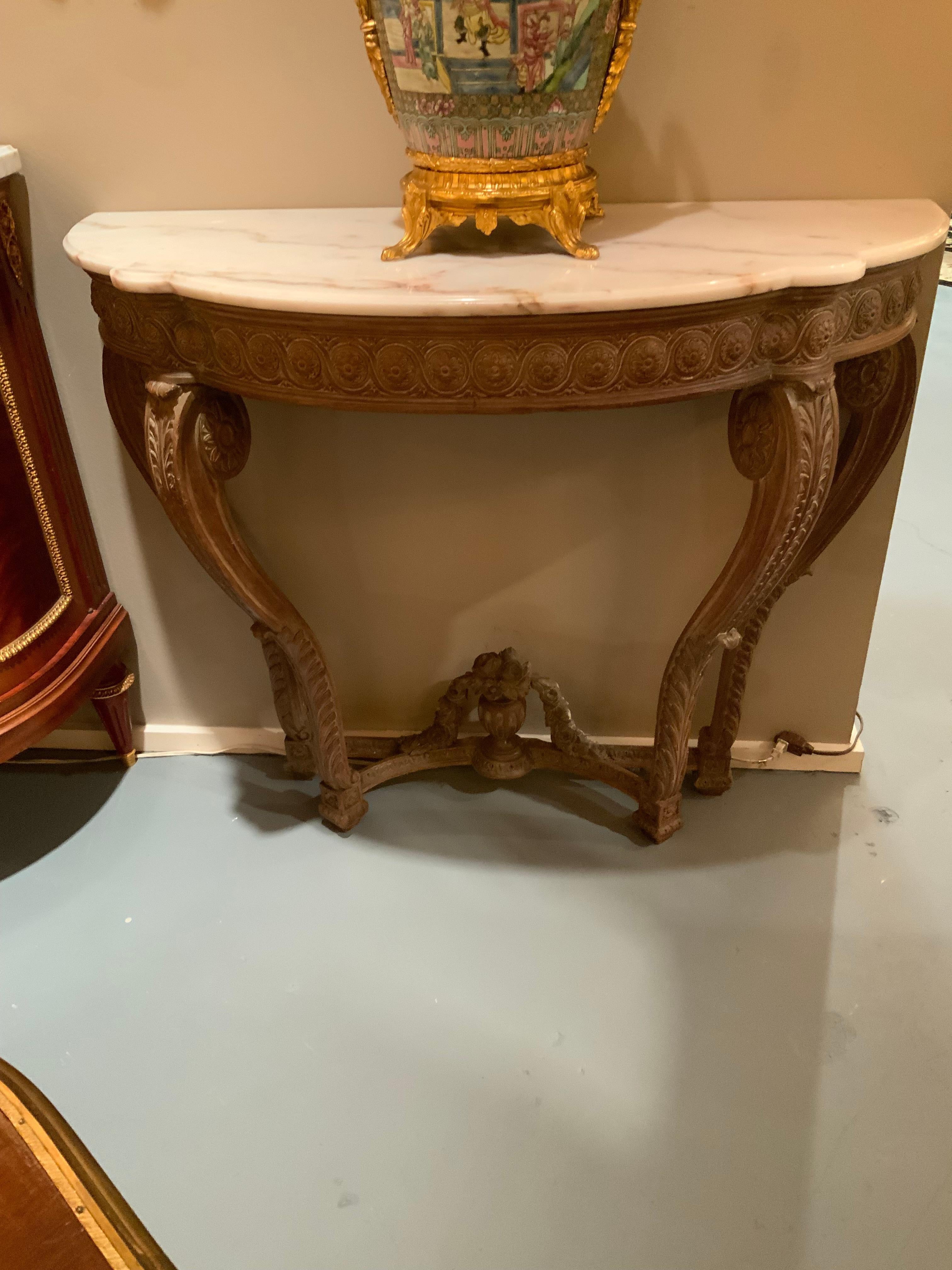 Pair of French carved Demi lune shaped console tables with white marble tops In Excellent Condition For Sale In Houston, TX