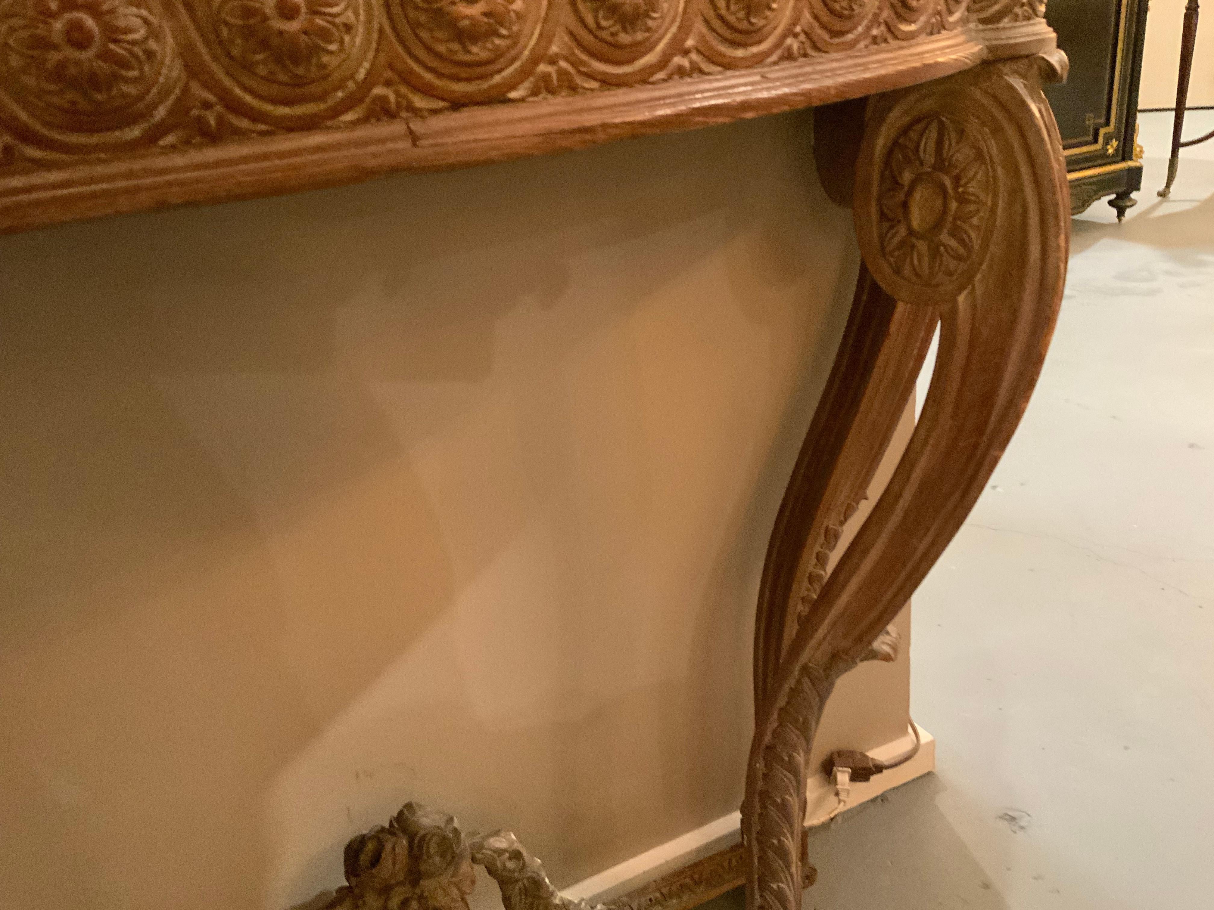 20th Century Pair of French carved Demi lune shaped console tables with white marble tops For Sale