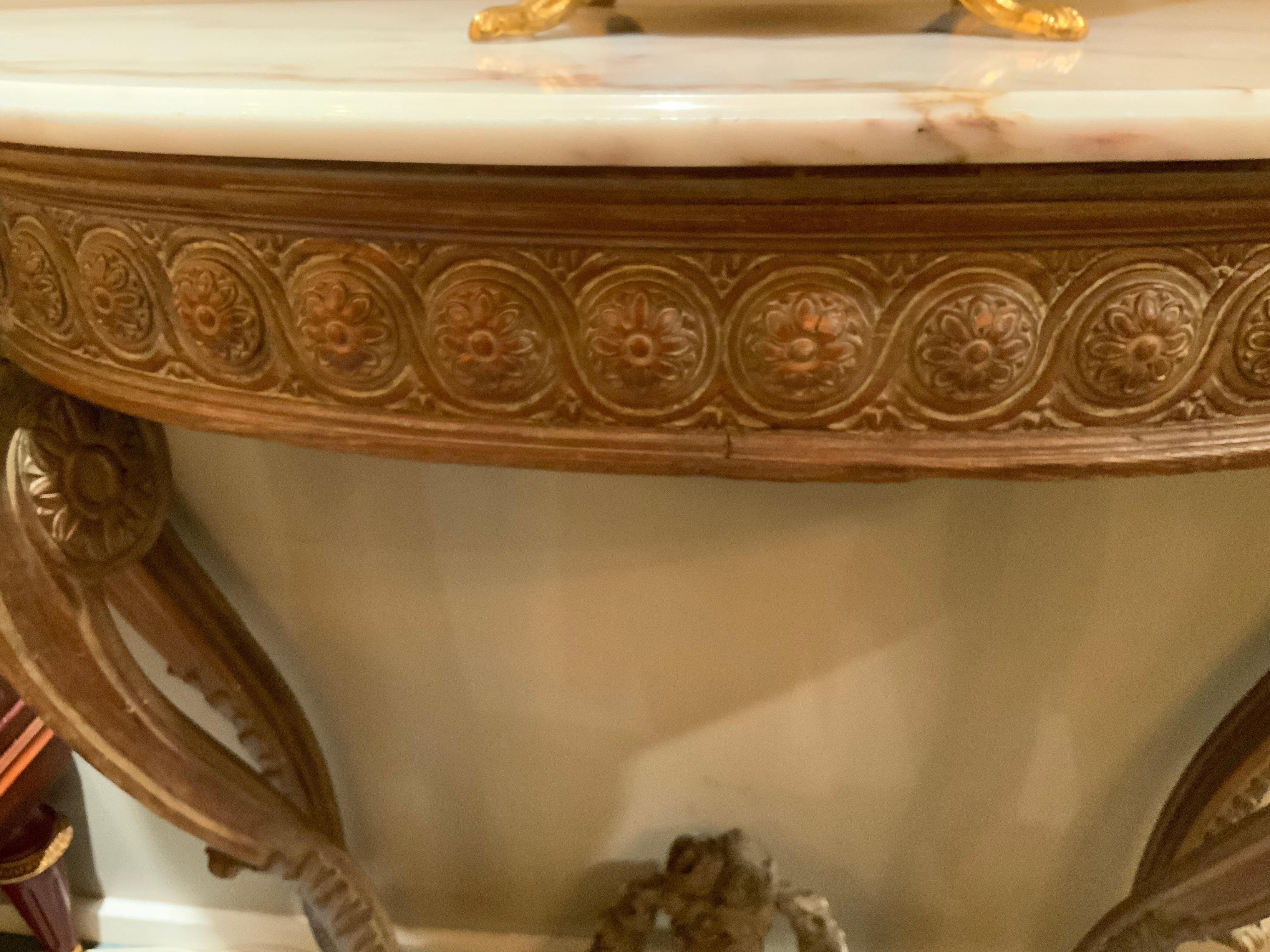 Marble Pair of French carved Demi lune shaped console tables with white marble tops For Sale