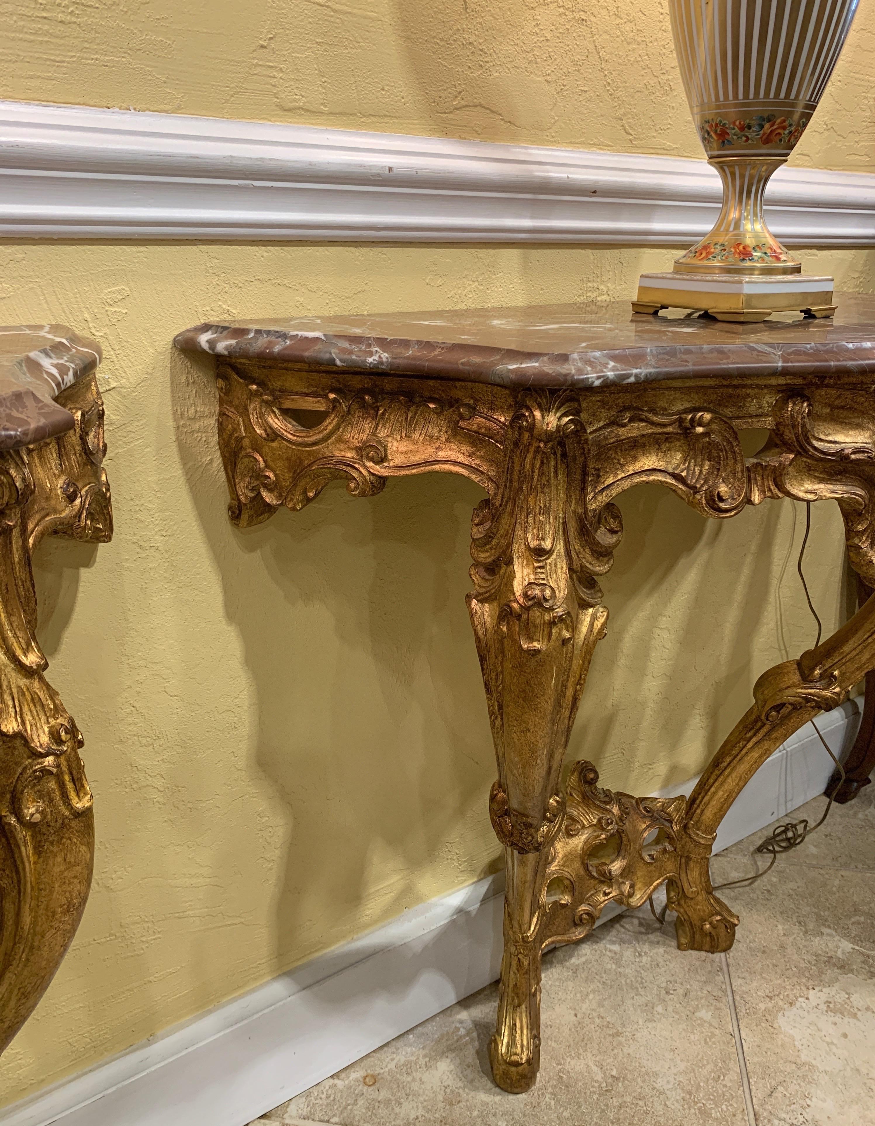 20th Century Pair of French Carved and Gilt Rococo Style Marble Top Consoles