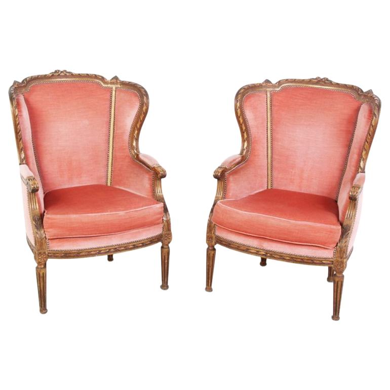 Pair of French Carved Gilt Wingback Chairs