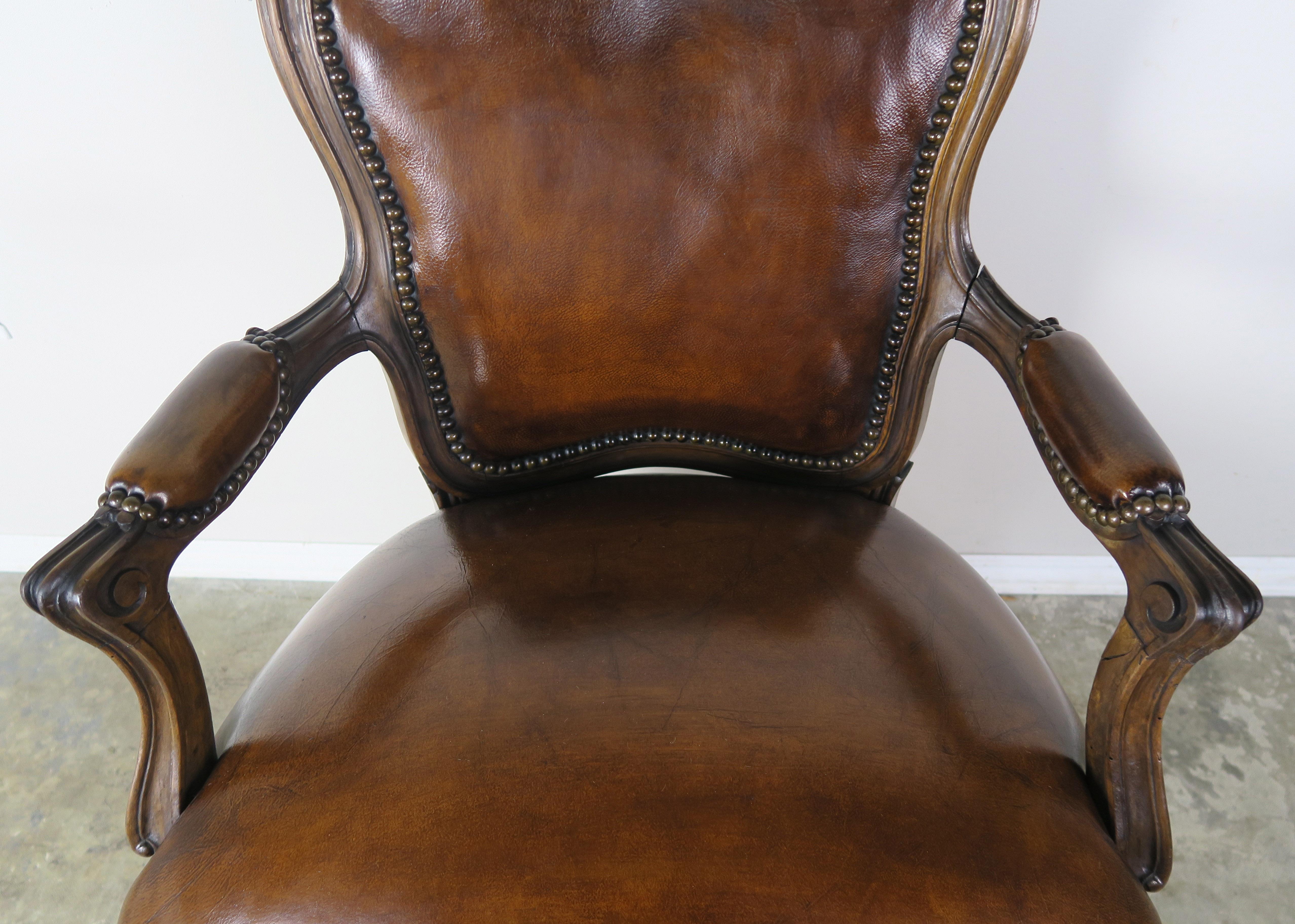 Pair of French Carved Leather Upholstered Armchairs In Distressed Condition In Los Angeles, CA