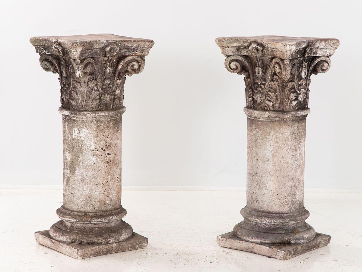 A pair of French limestone Corinthian columns. French early 20th century. The columns are multipurpose and can be used as pedestals for statuary or garden ornaments, or glass or stone can be placed on them to create a stunning and one-of-a-kind