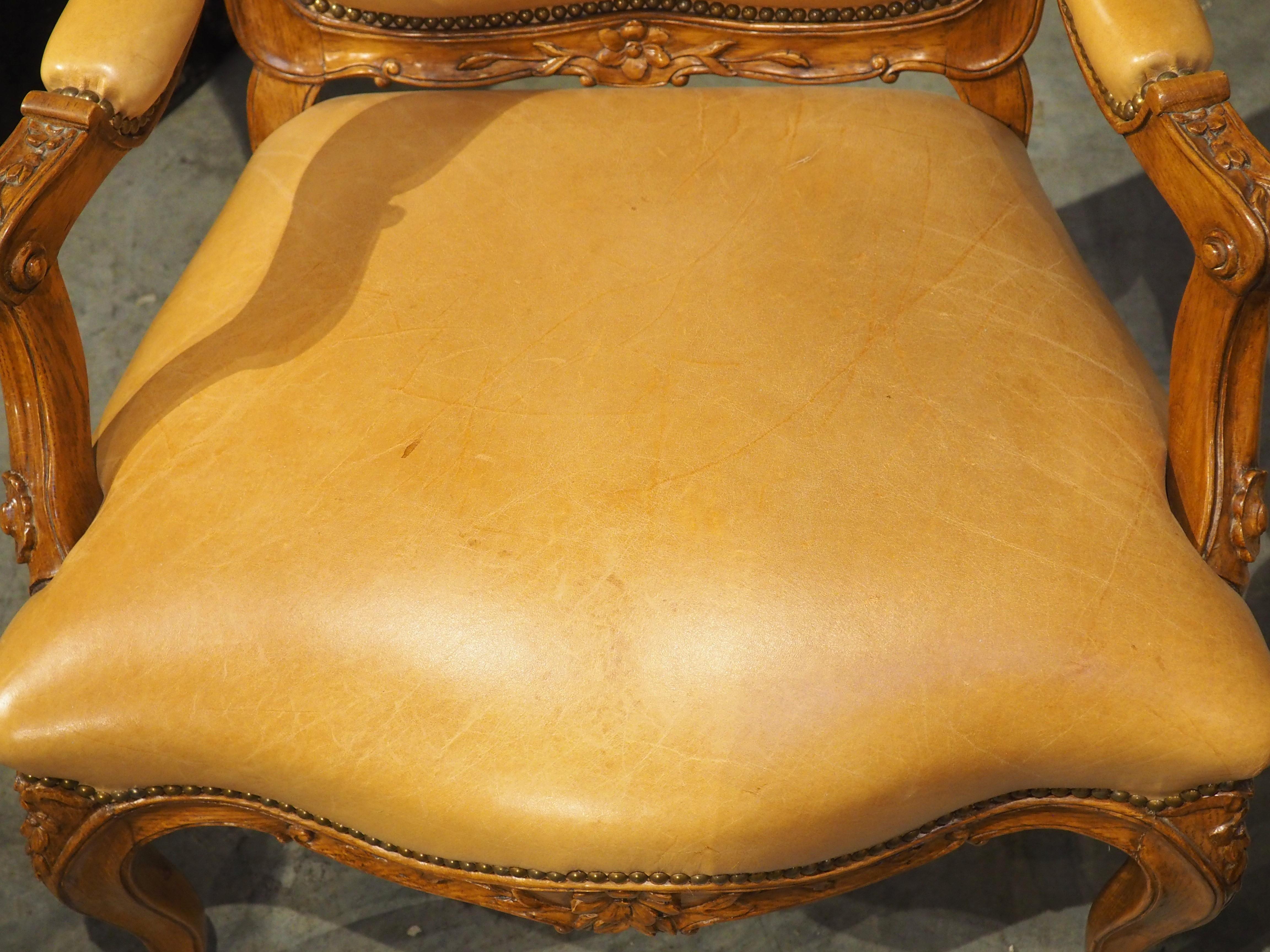 Hand-Carved Pair of French Carved Regence Style Armchairs with Leather Upholstery, C. 1900 For Sale