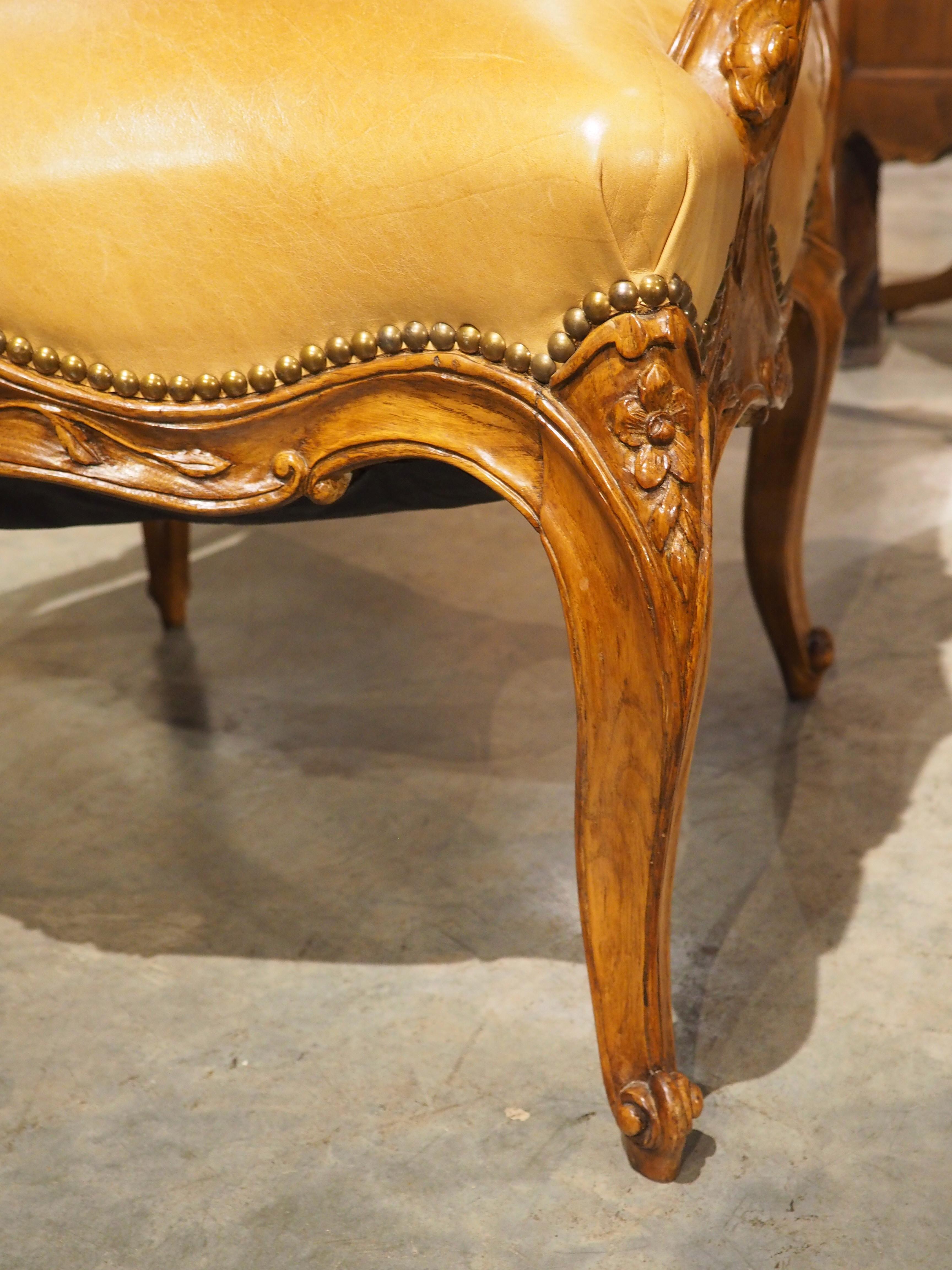 Metal Pair of French Carved Regence Style Armchairs with Leather Upholstery, C. 1900 For Sale