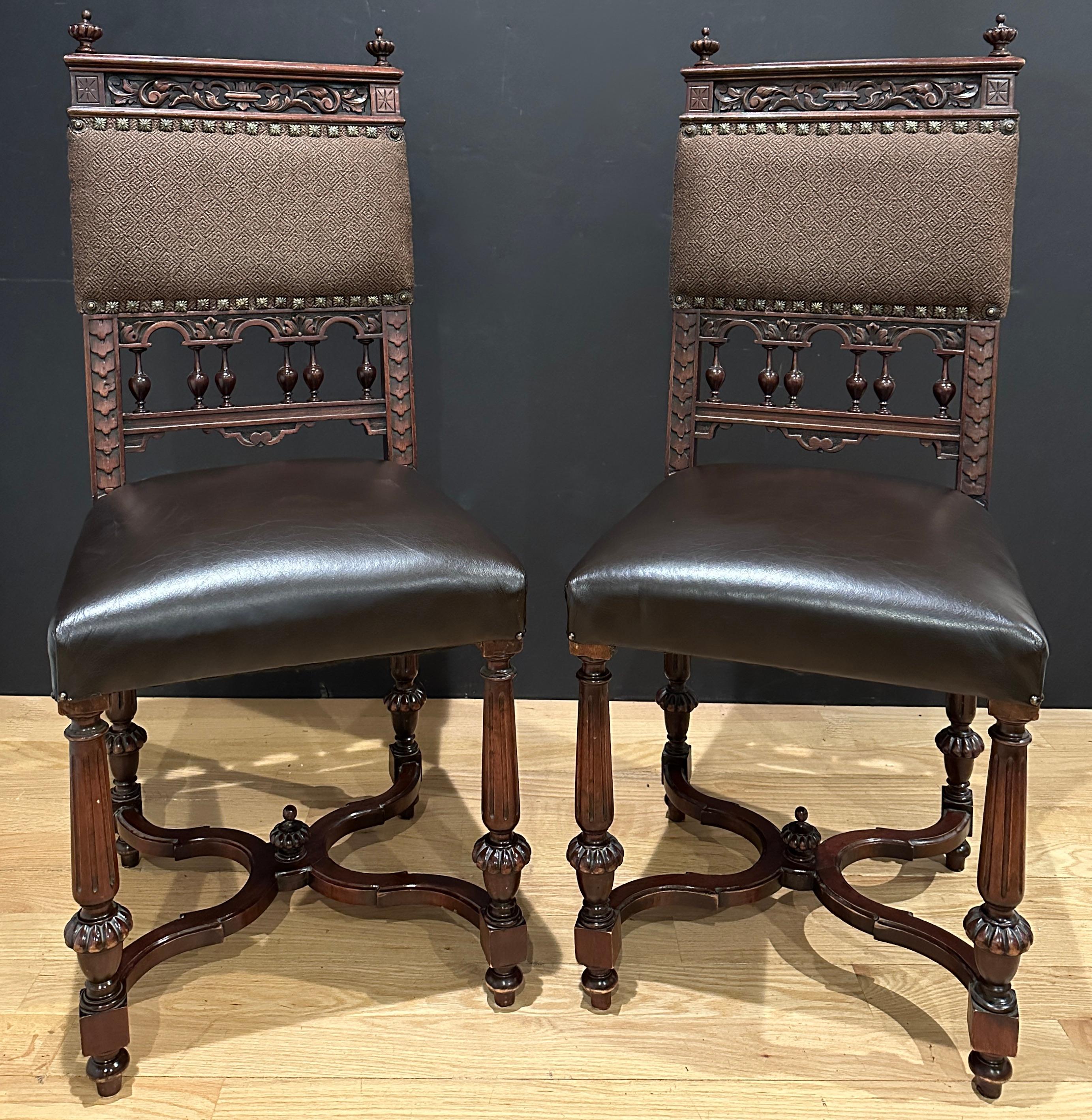 Pair of fine quality 19th century carved walnut, leather and fabric upholstered side chairs. Square brass nailheads adorn the top upholstery. X form cross stretcher.