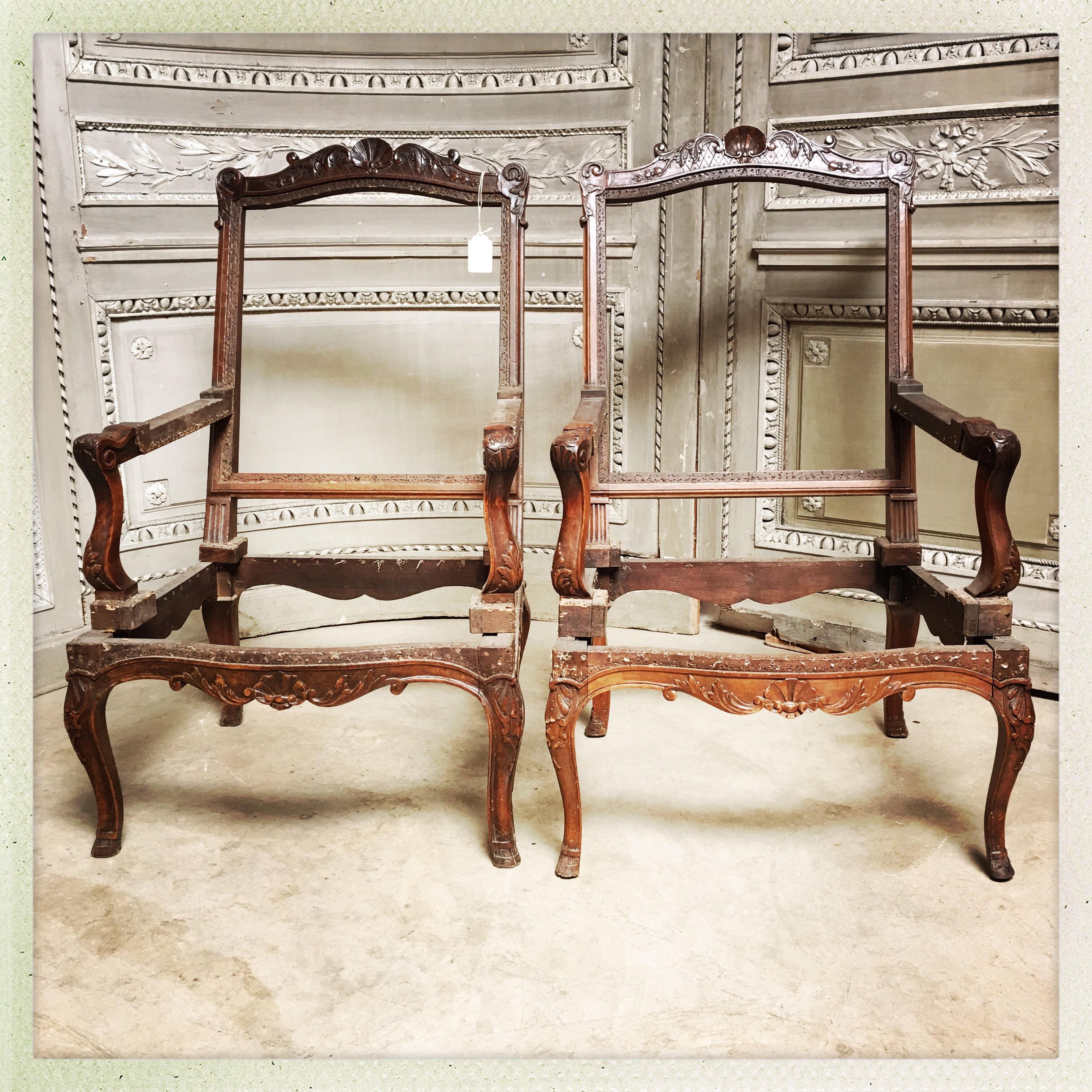 19th Century Pair of French Carved Walnut Regence Style Fauteuils For Sale