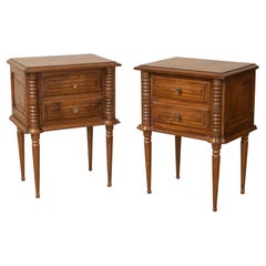 Coppia di comodini francesi in legno intagliato di Charles Dudouyt