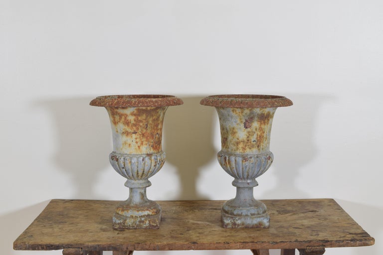 Empire Pair of French Cast Iron and Parcel Painted Campana Form Urns Early 20th Century For Sale