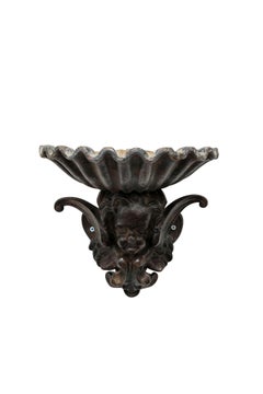 Pair of French Cast Iron Angel Head Vessels