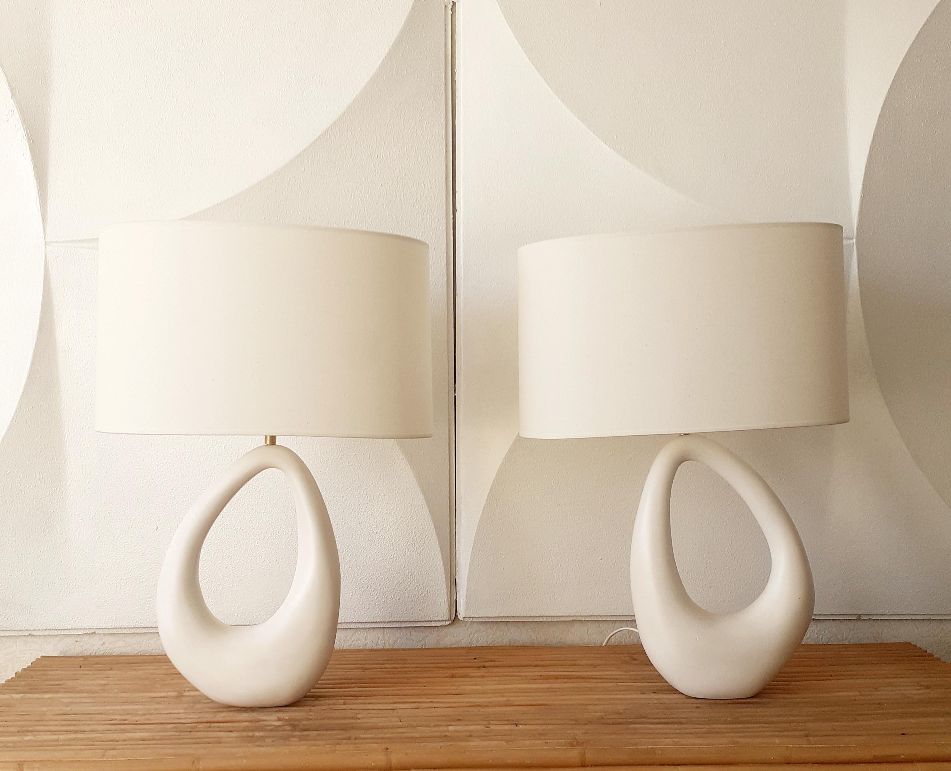 - Elegant ceramic lamp with shade, handmade in Parisian workshop by Elsa Foulon Studio.
Mineral, organic and sensual shape.
Cotton shade, brass structure, soft white enameled ceramic, screw bulb. 
UL listed electricity on request.
Ceramic