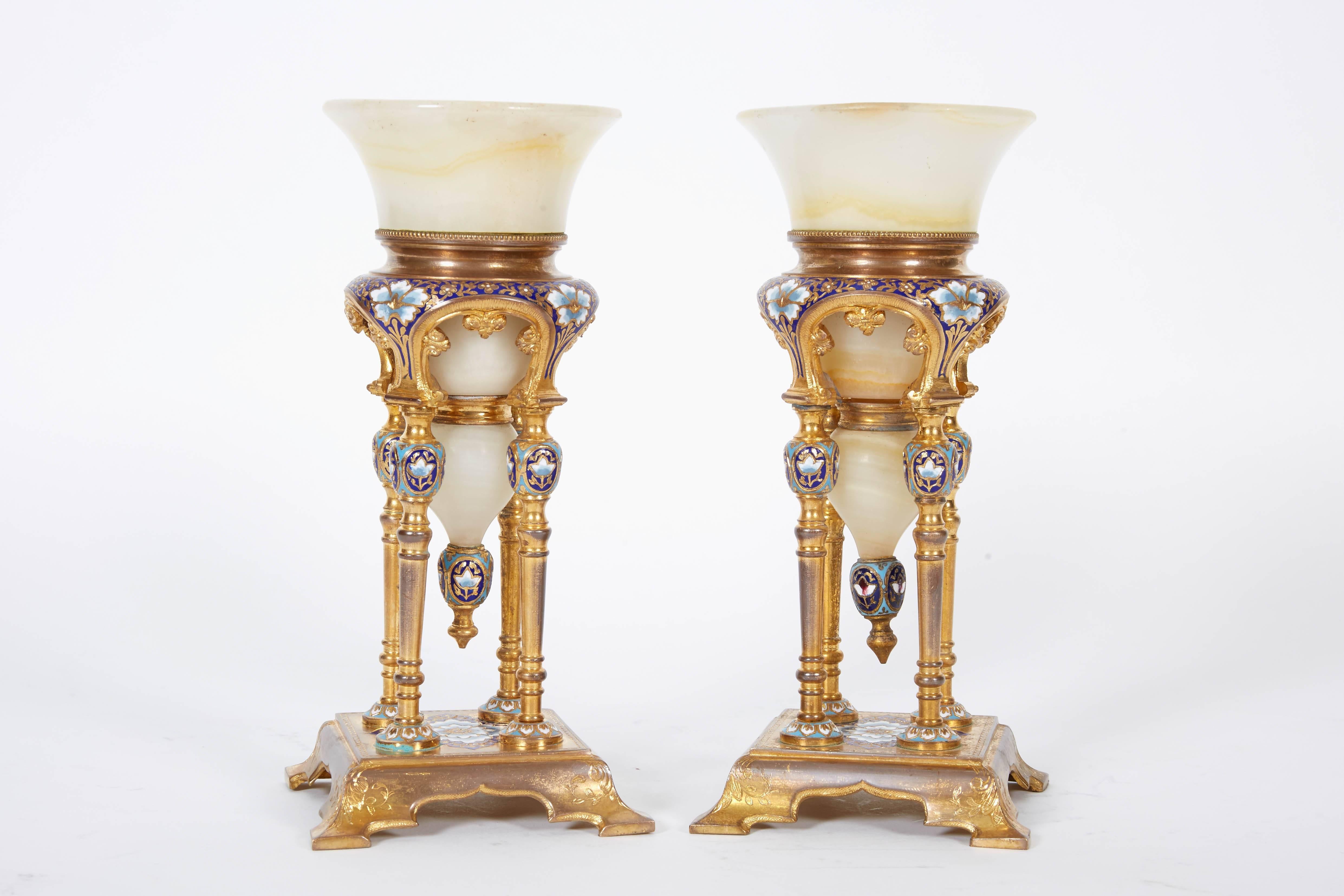 A pair of French bronze, Champleve enamel and onyx bowls / vases in the orientalist Islamic taste,
late 19th century.

Attributed to Eugene Cornu / Louchet Freres.

Very high quality. Excellent condition.

Measures: 6.5