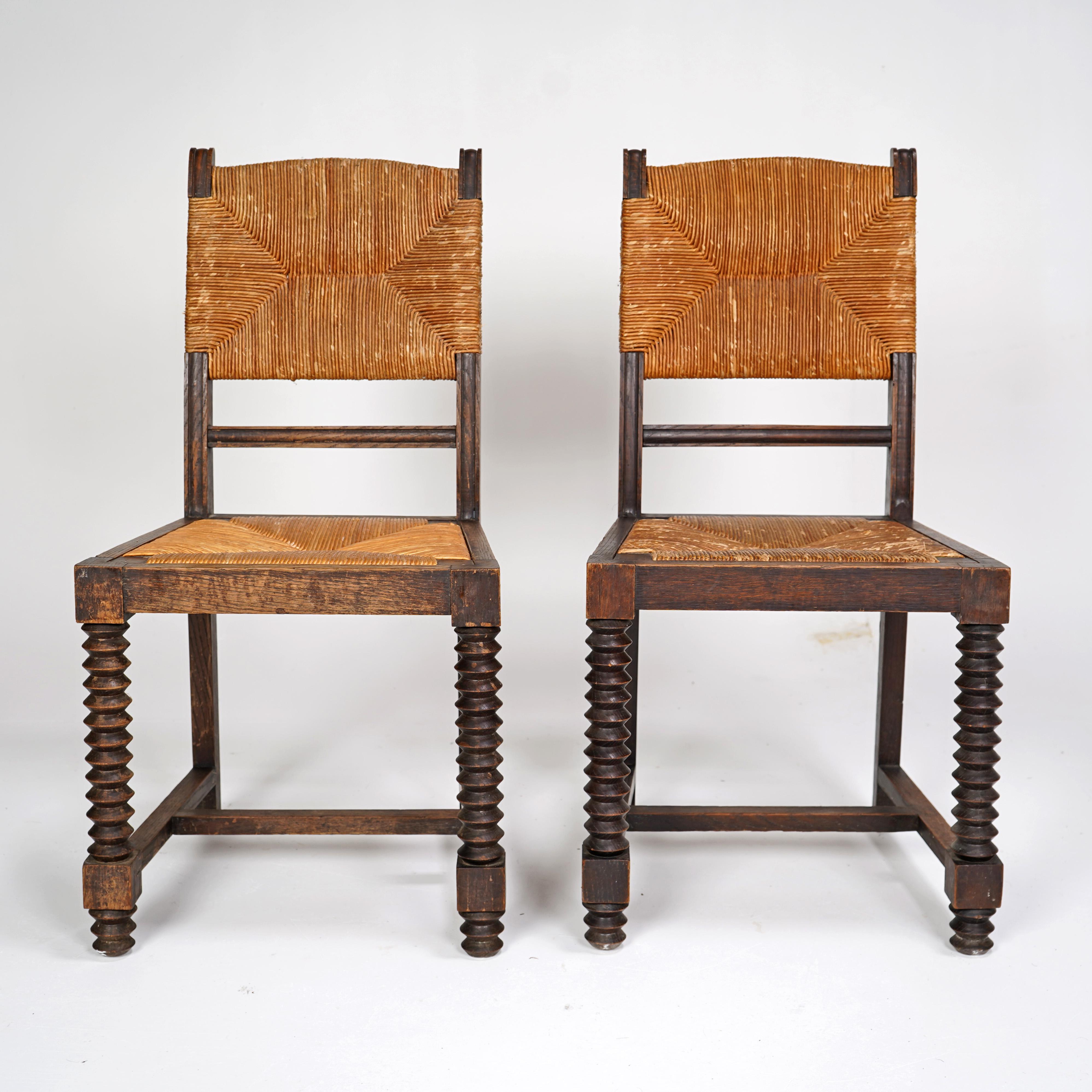  Pair of Charles Dudouyt style chairs with rush seat and back. French circa 1940s.

Dimensions
 
Height - 90cm
Width - 45cm
Depth - 42cm

About Us  
We are Stowaway London a small online business which sells a selection of Vintage & Antique