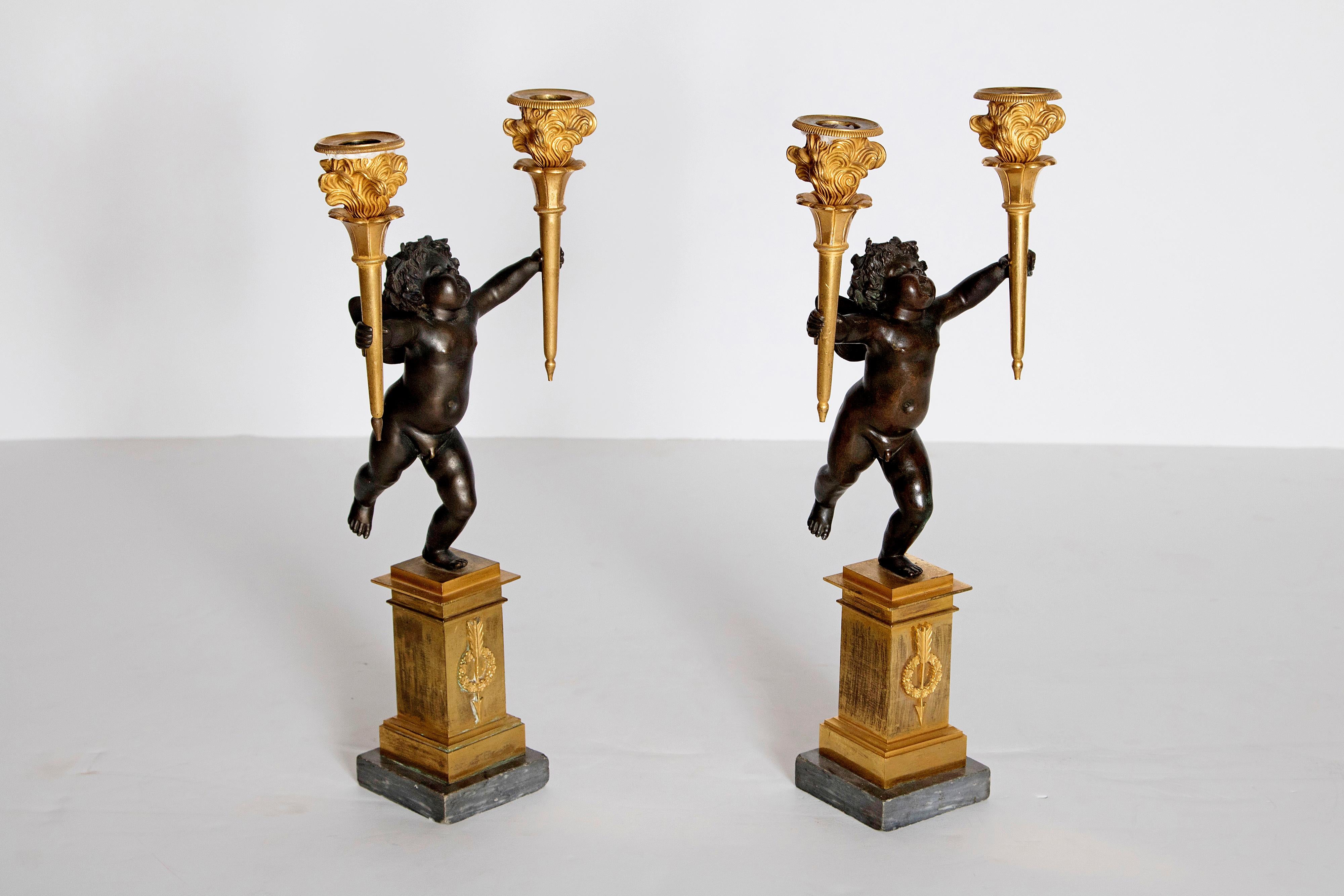 Pair of French Charles X Patinated Bronze and Gilt Figurative Candelabras In Good Condition For Sale In Dallas, TX