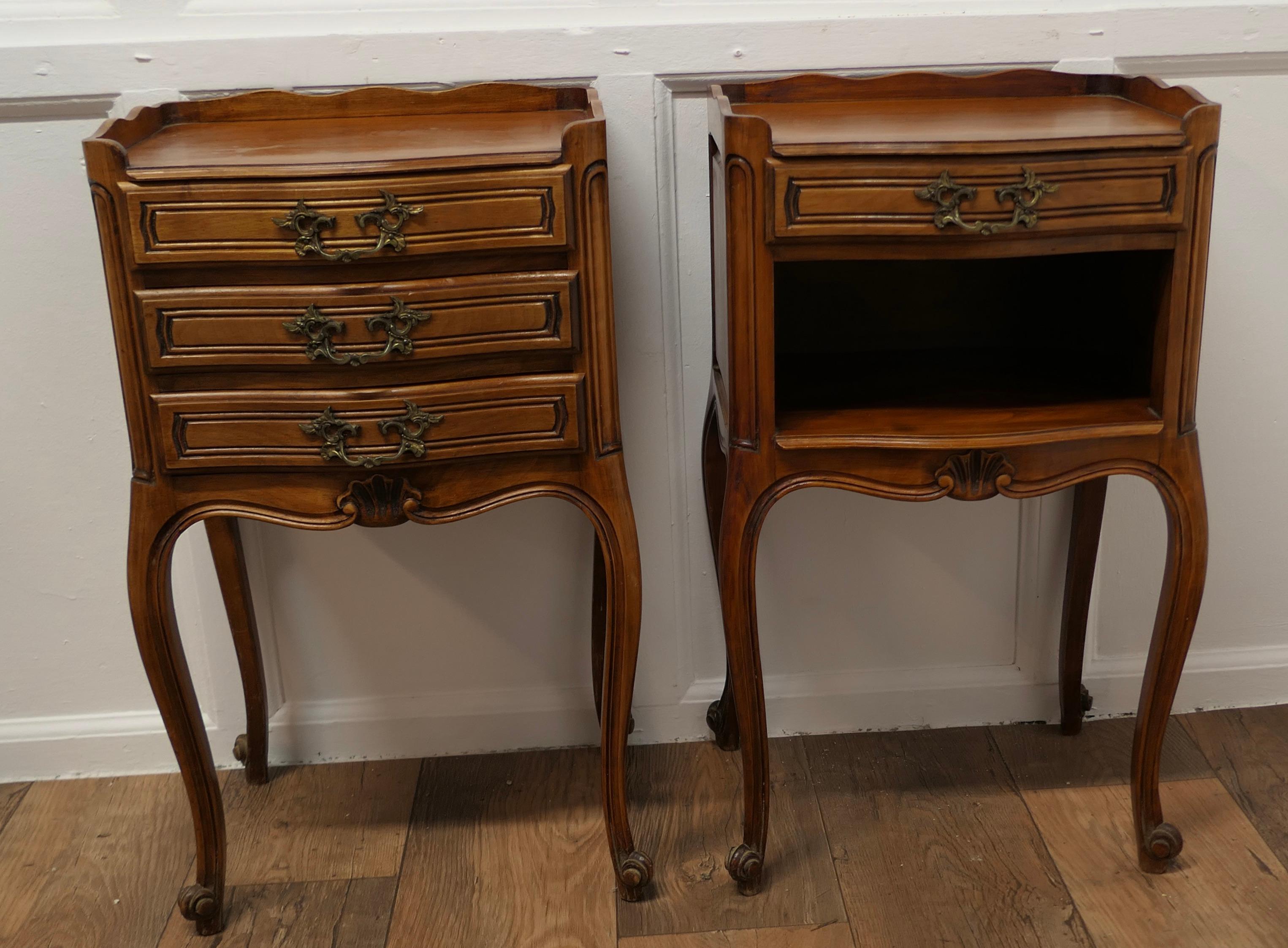 Pair of French Cherry Wood Bedside Cabinets or Cupboards

This is a pretty pair of cabinets or chevets, they have a slightly bow front shape to their fronts and a scalloped gallery around the top, they stand on very elegant cabriole legs with