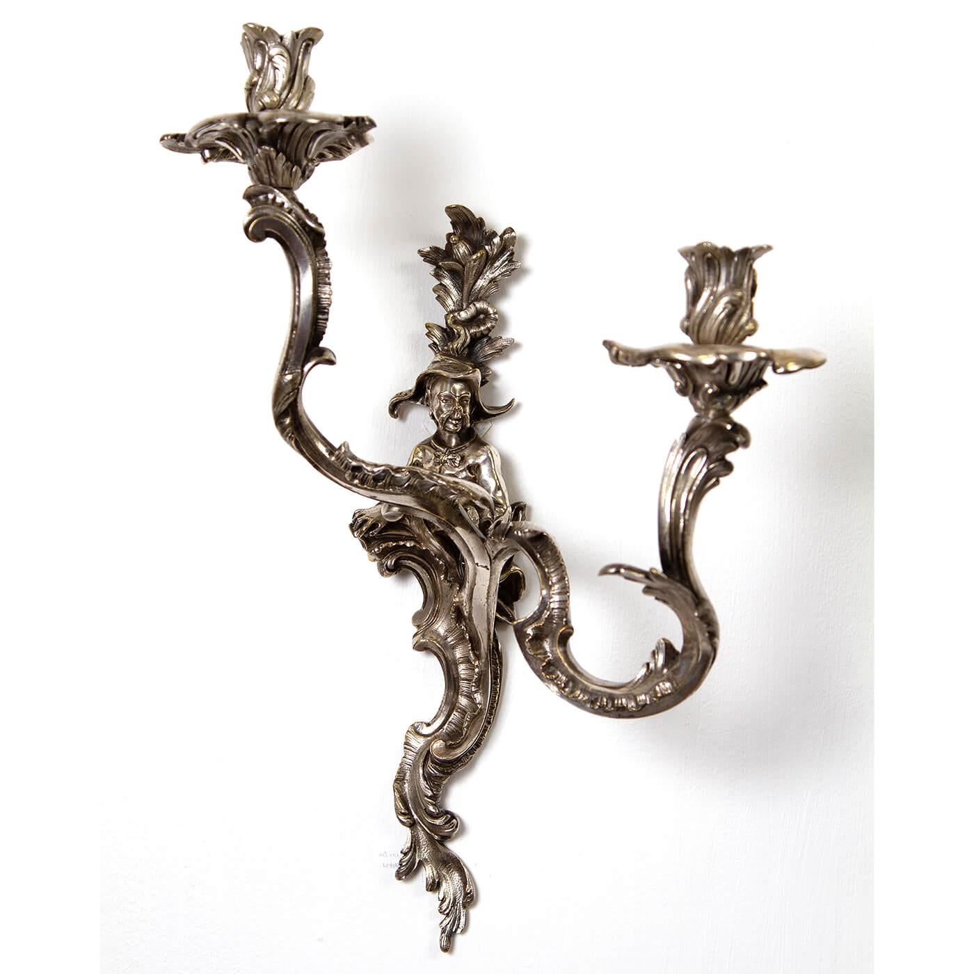 A fine pair of French Louis XV sconces with a finely cast silvered bronze, the Chinsoierie male and female figures with elaborate leaves, C scrolls, and floral motifs. 

France, ca 1890

Dimensions: 11