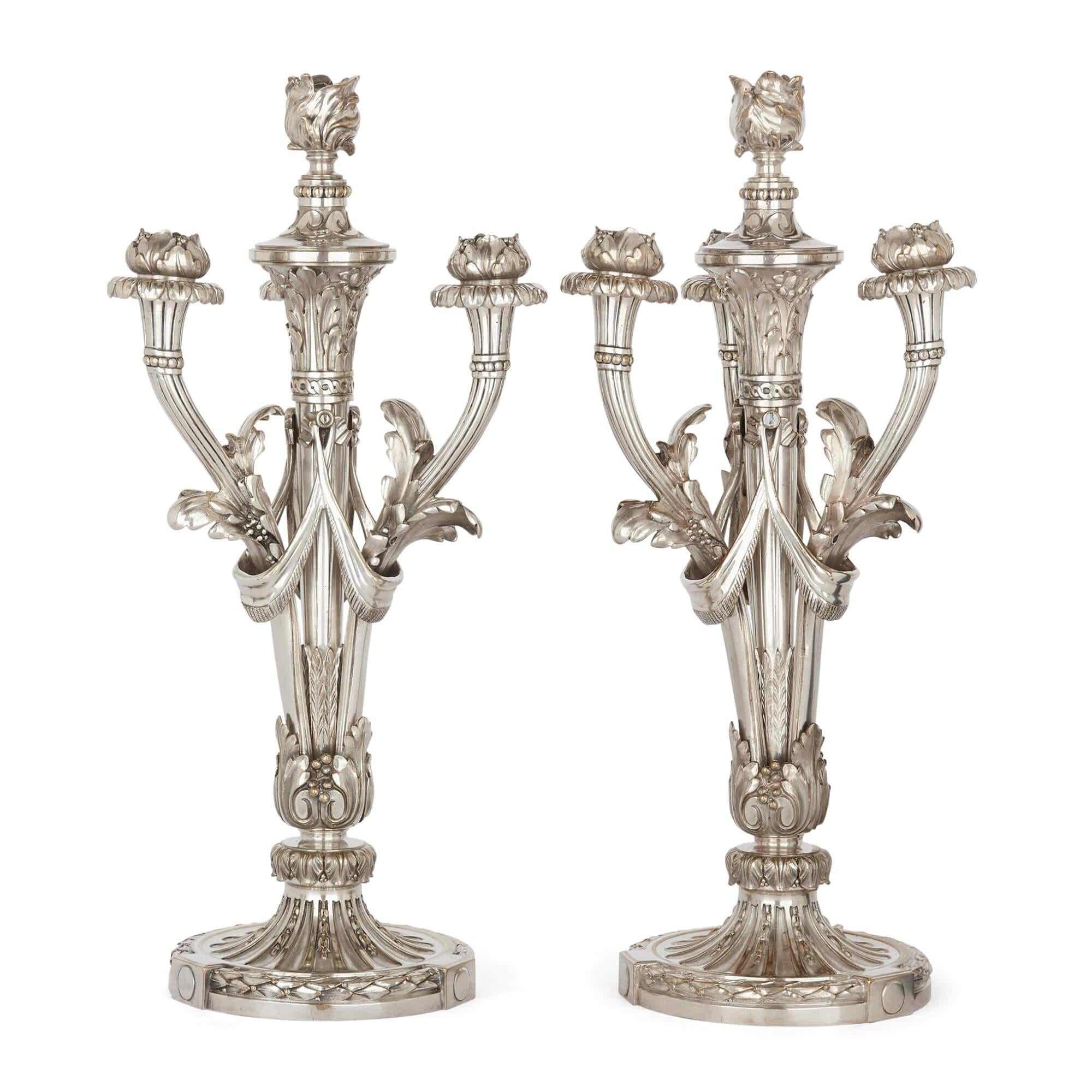 Pair of French Christofle table candelabra in silvered bronze
French, late 19th century
Measures: Height 49cm, width 22cm, depth 22cm

These fine Christofle silvered bronze candelabra are designed in a classical style that in many ways hints at