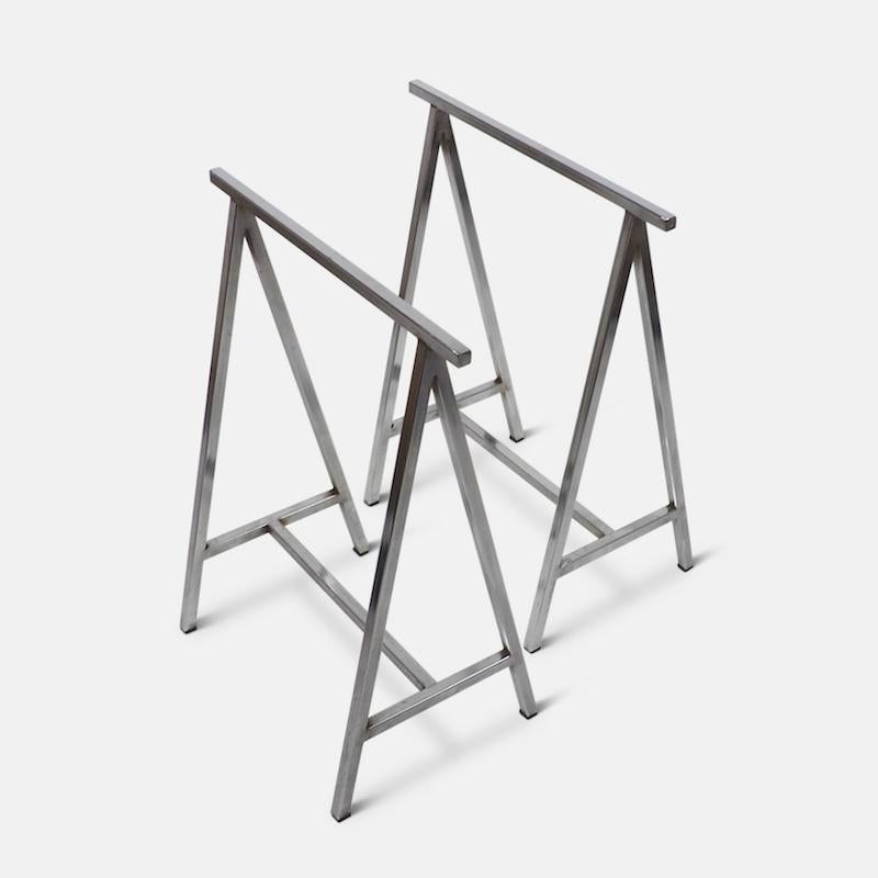 Pair of French chromed metal table trestles. These stylish and versatile trestles date from the 1970s and were designed to work with a number of different tops from marble to plate glass. 
Sold without top.
       