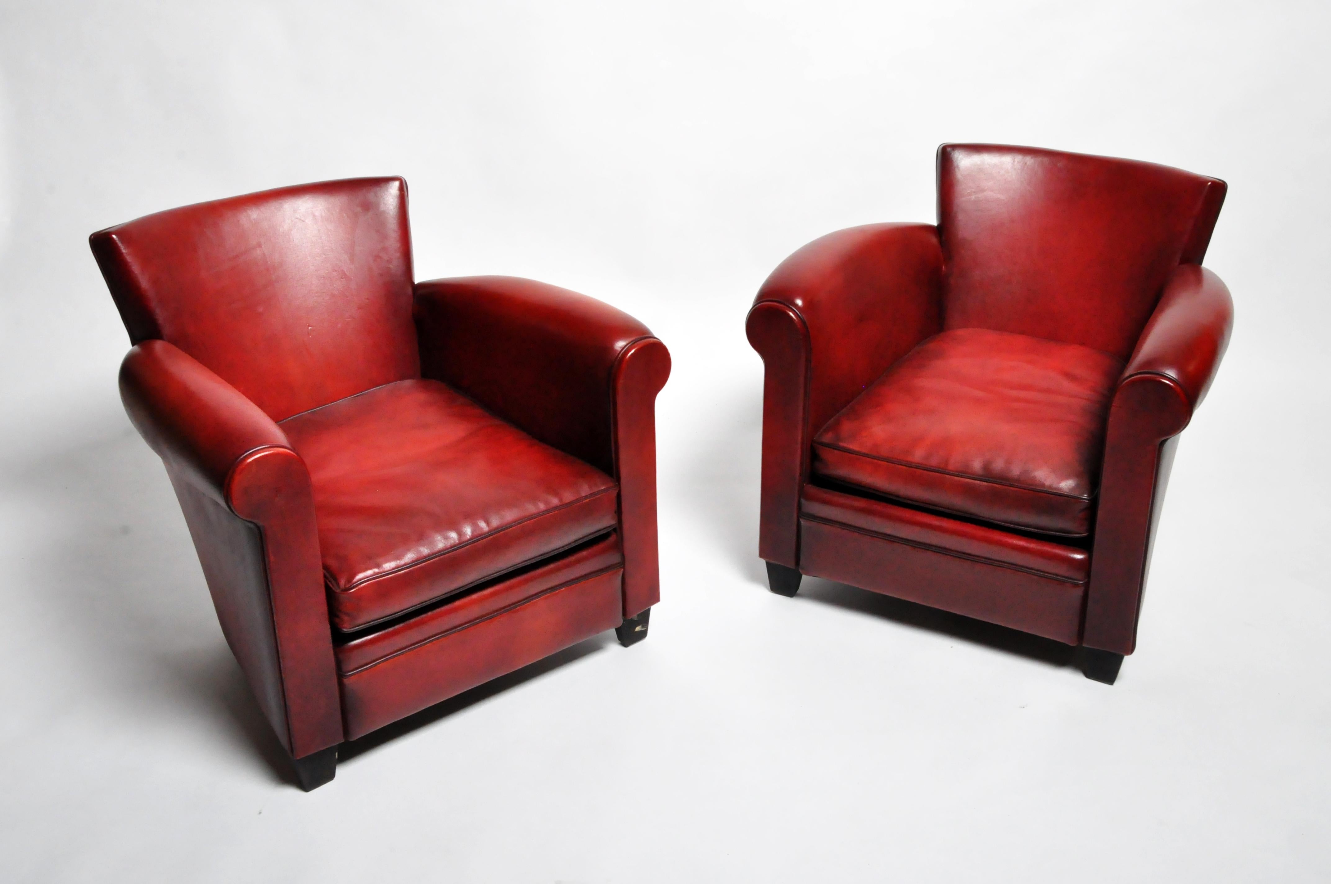 These elegantly-scaled Parisienne club chairs are newly made according to an Art Deco design. The leather is lamb leather which is exceptionally soft and supple. These smaller club chairs are unusually comfortable (due to seat height and ample