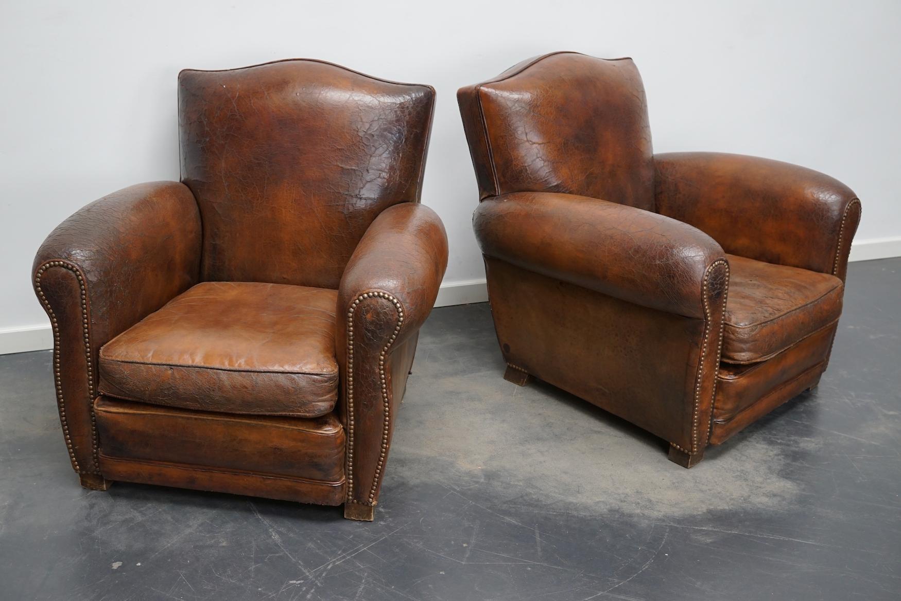 Industrial Pair of French Cognac Moustache Back Leather Club Chairs, 1940s