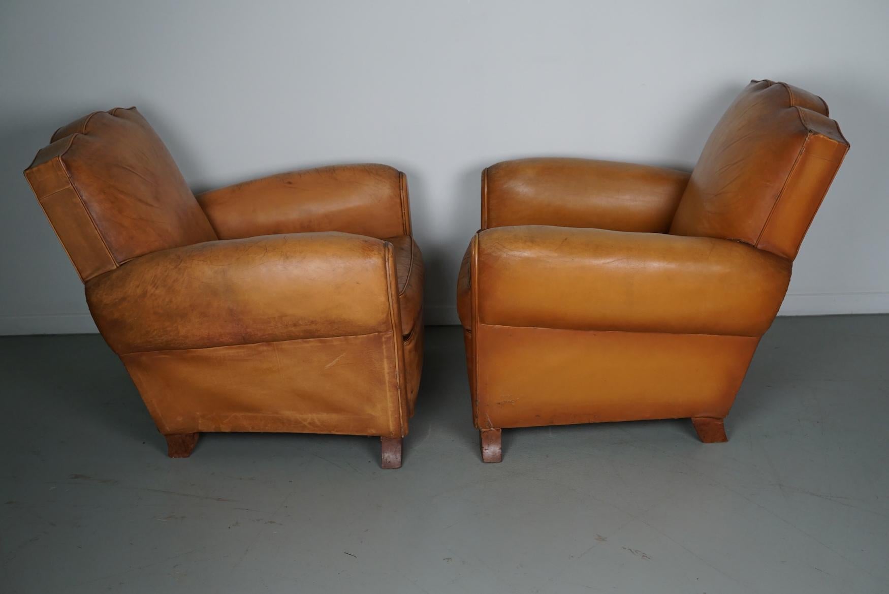 Industrial Pair of French Cognac Moustache Back Leather Club Chairs, 1950s For Sale
