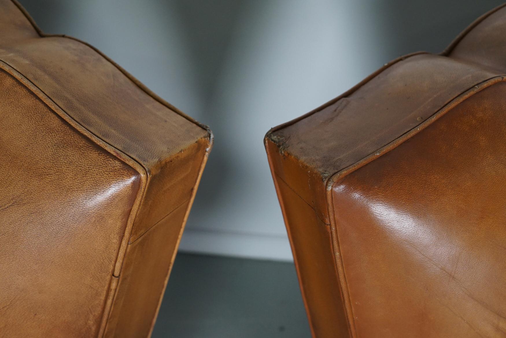 Mid-20th Century Pair of French Cognac Moustache Back Leather Club Chairs, 1950s For Sale
