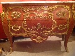 Pair of French Commodes Bombe' Form with Elaborate Bronze Mounts
