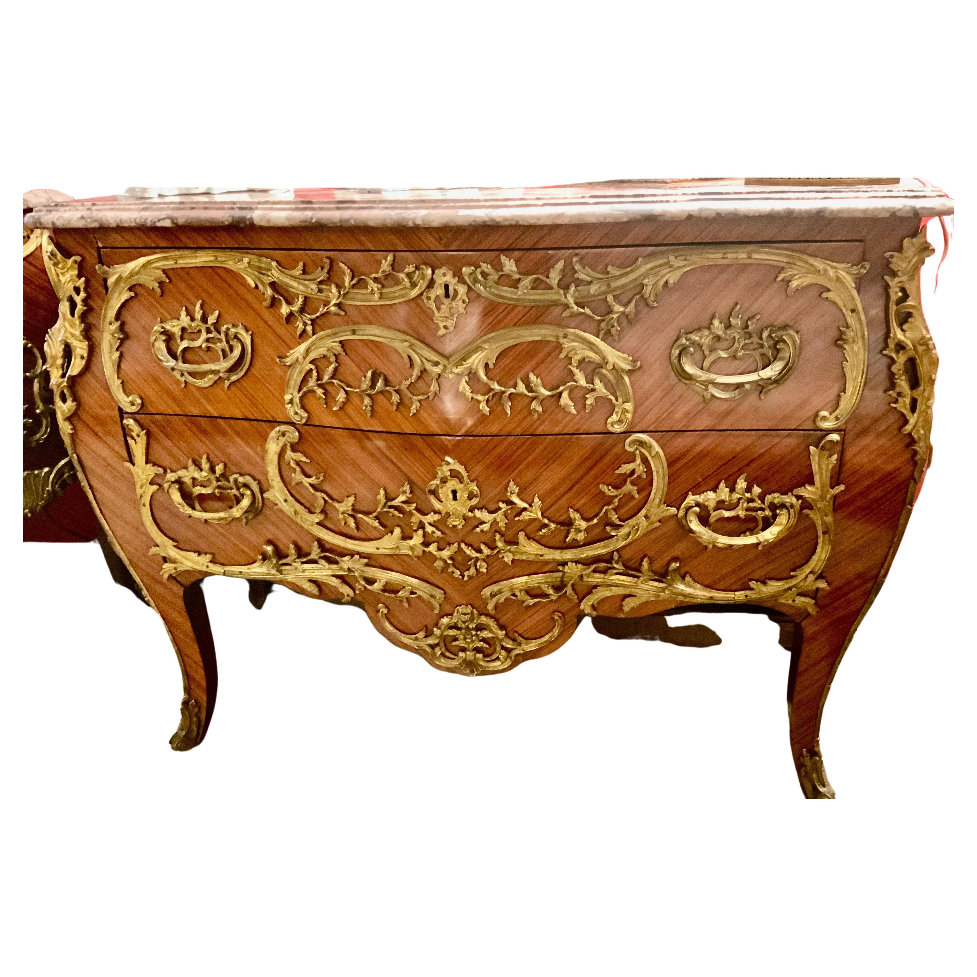 Pair of French Commodes bombe' form with elaborate bronze mounts For Sale