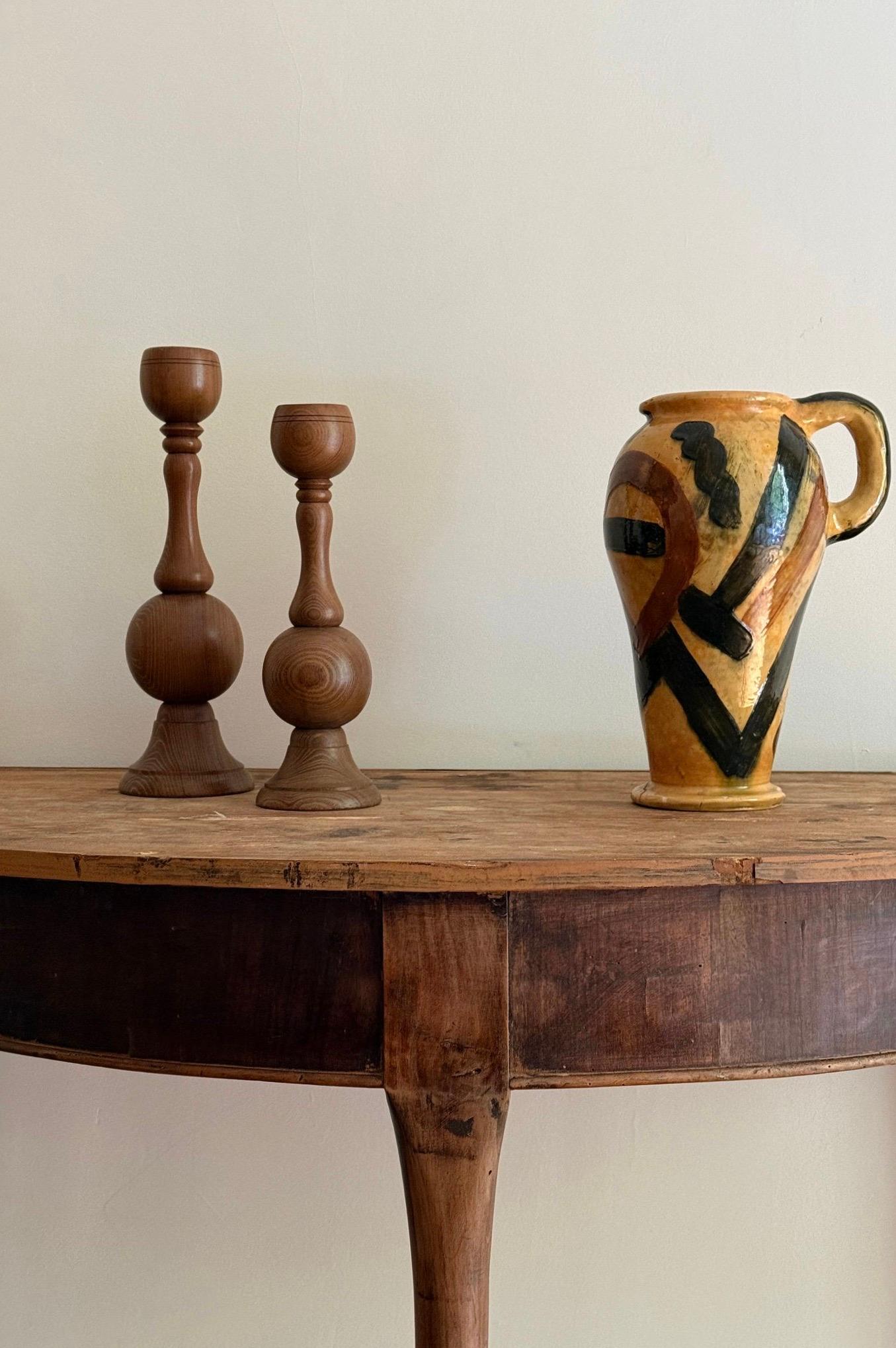 Pair of half-moon shaped wooden French consoles. Can be converted into a round side table by joining the two pieces together.

Height: 78cm
Length: 120cm
Width: 60cm