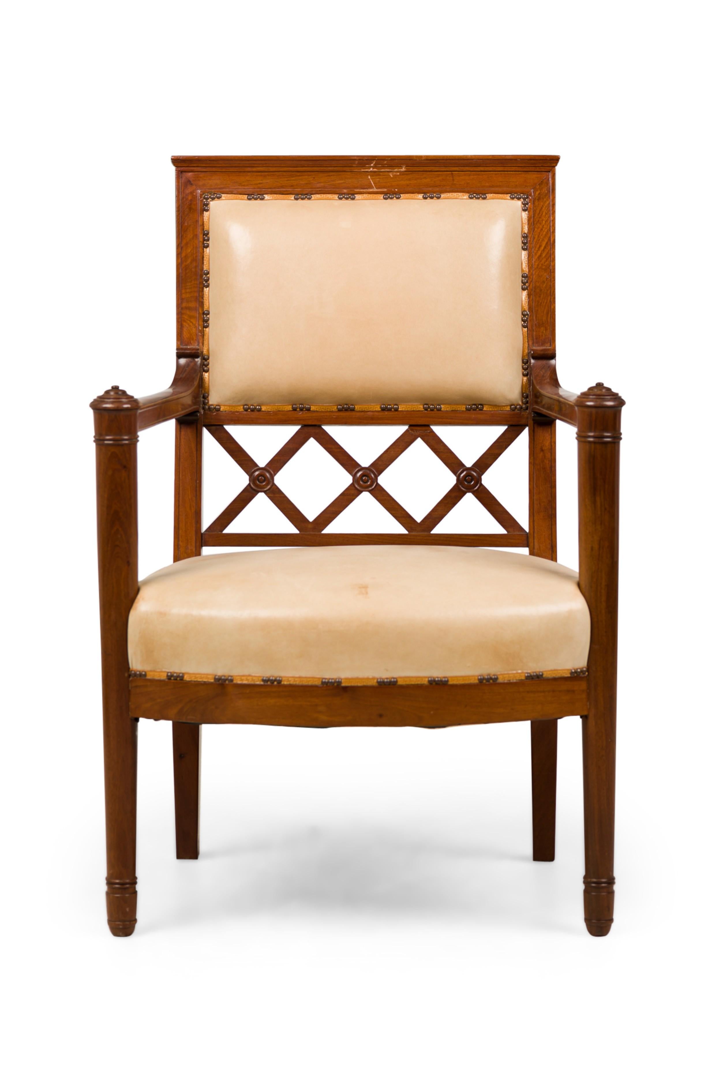 PAIR of French Consolate mahogany (circa 1800) open arm chairs with beige leather seat and square back with an open X design (PRICED AS PAIR)
