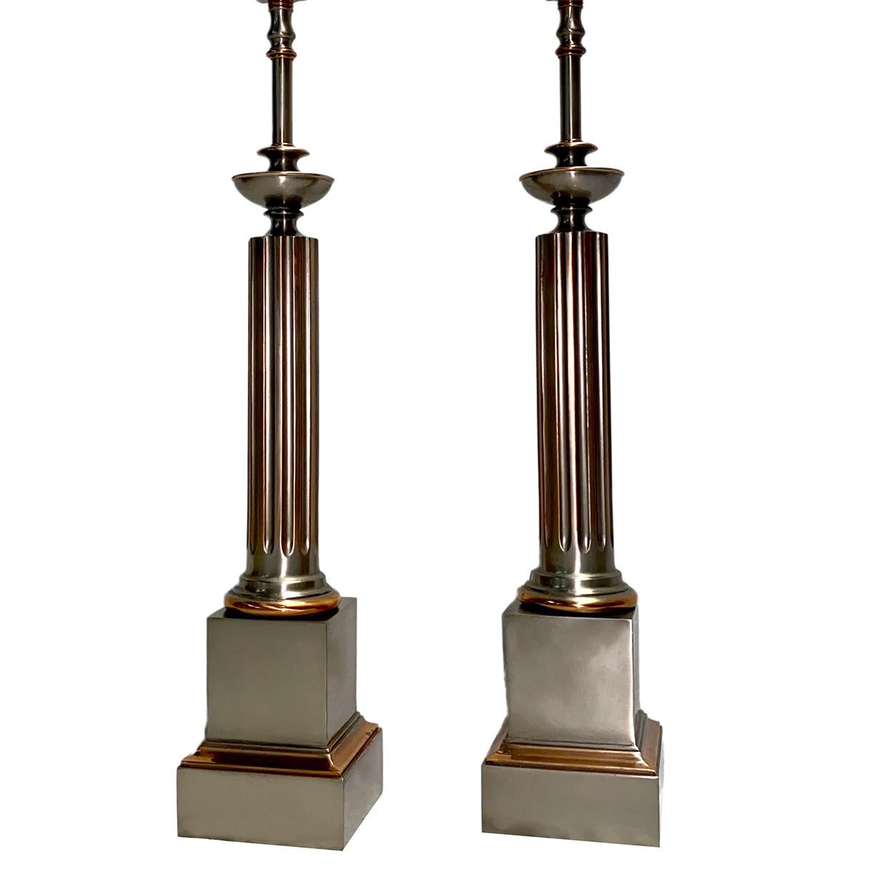 A pair of circa 1930's French neoclassic column table lamps with original pewter and copper patina.

Measurements:
Height of body: 24