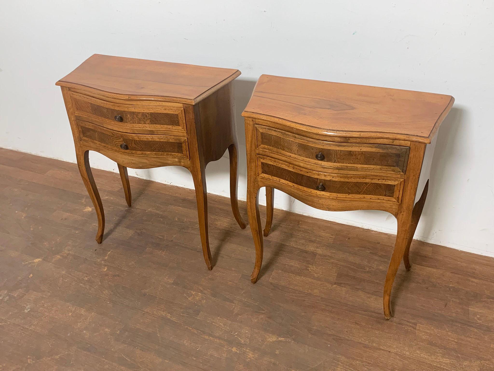 A pair of Louis XVI French Country style nightstands in walnut circa 1950s.