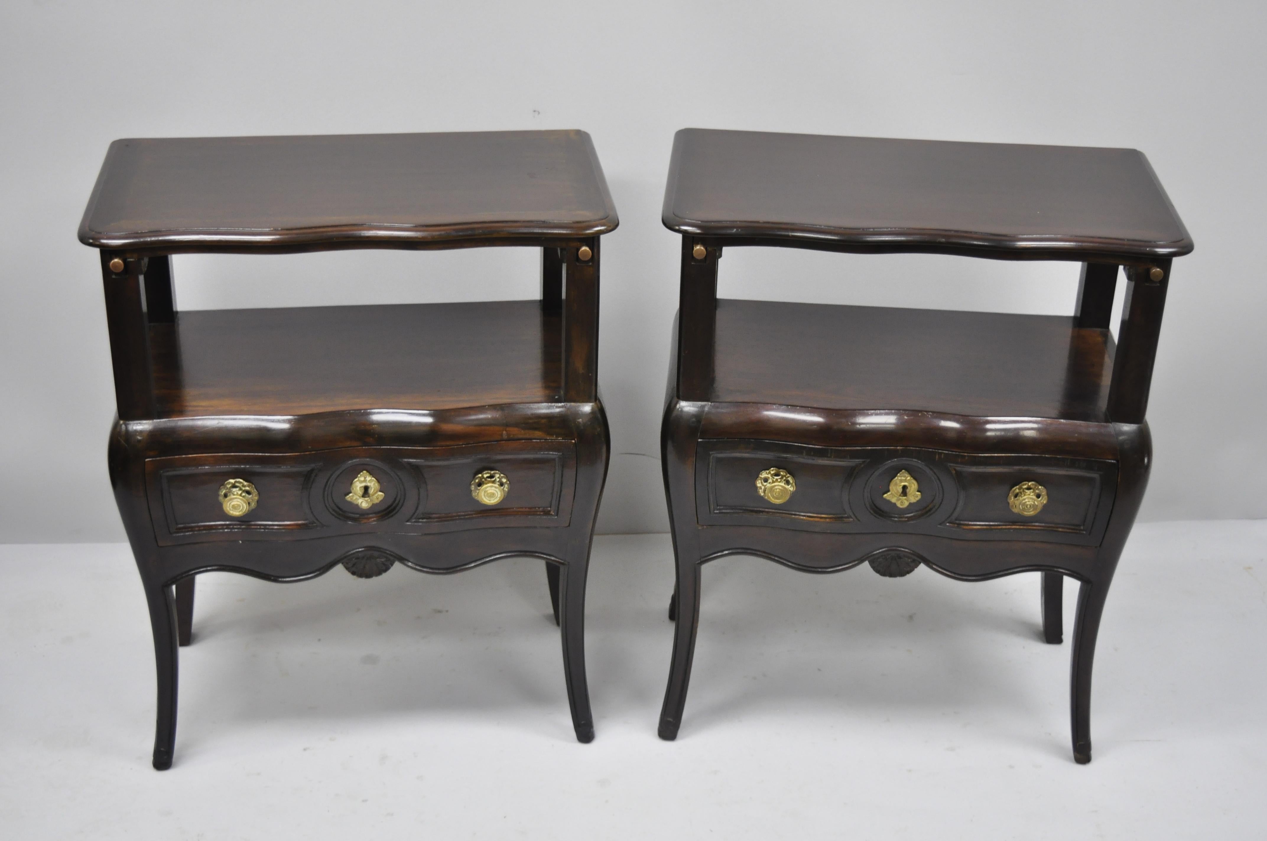 Pair of French country Provincial style bombe nightstand attributed to Auffray. Items feature bombe sides, pull out surface, solid wood construction, distressed finish, 1 dovetailed drawer, shapely saber legs, quality craftsmanship, great style and