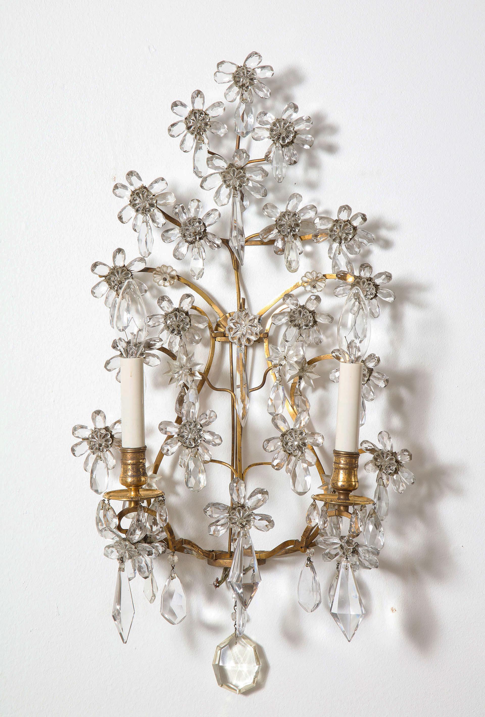 Each with bronze lyre form structure supporting a series of crystal clusters in the form of daisies, with 2 candle lights similarly draped with crystal.