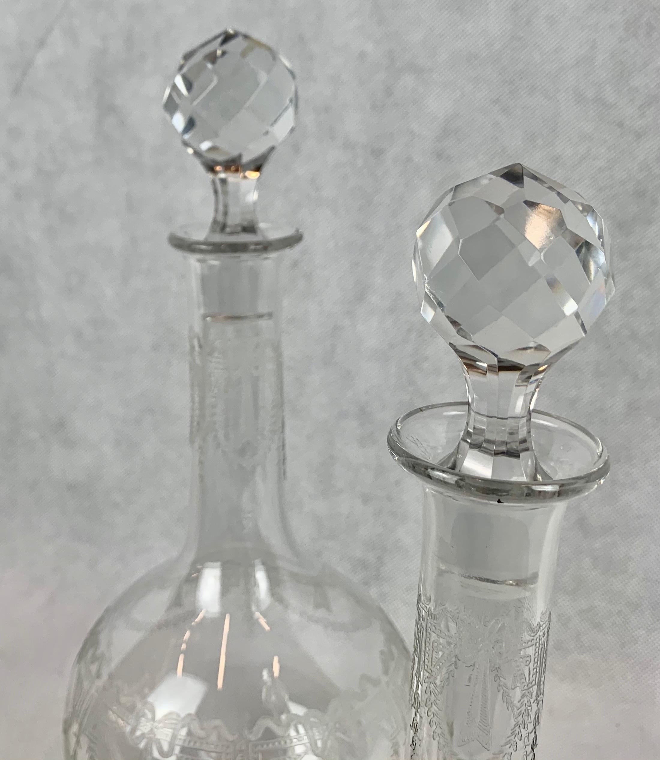 Belle Époque Set of Two French Crystal Decanters with Engraved Bodies and Faceted Stoppers