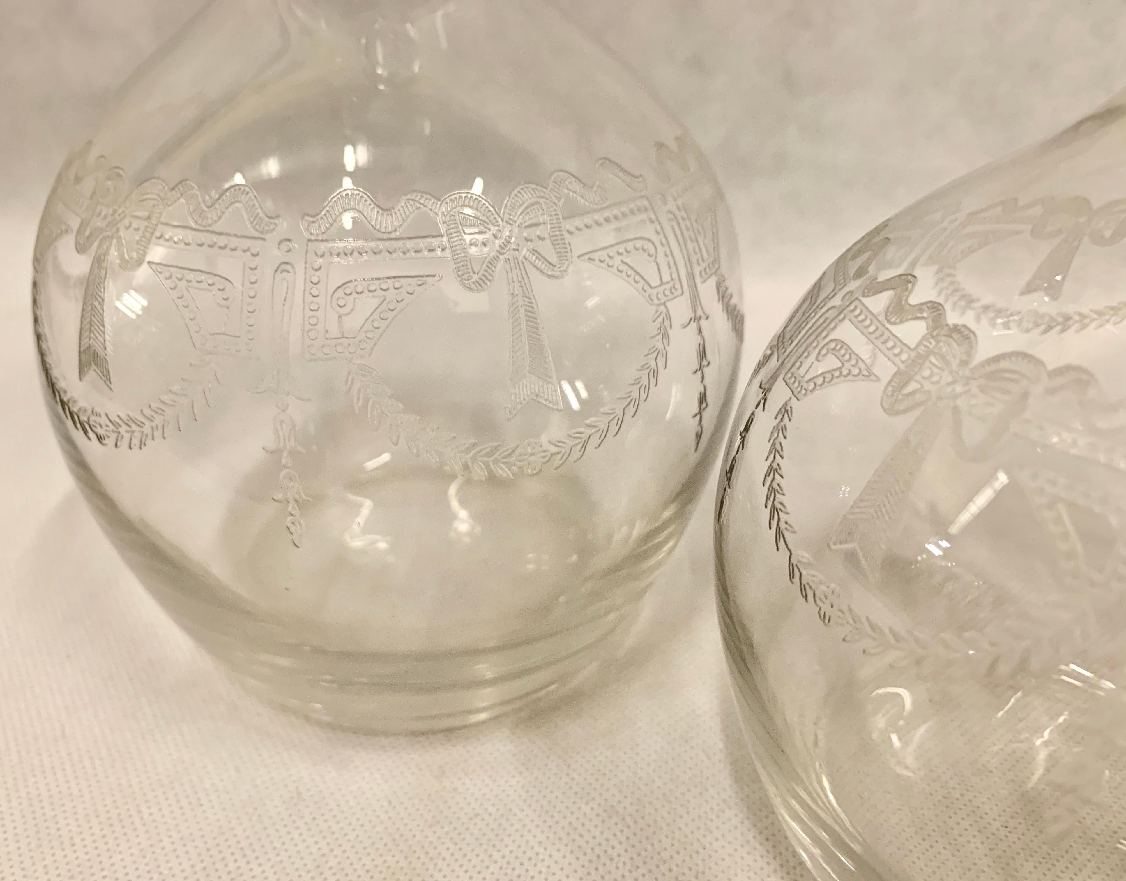 Early 20th Century Set of Two French Crystal Decanters with Engraved Bodies and Faceted Stoppers