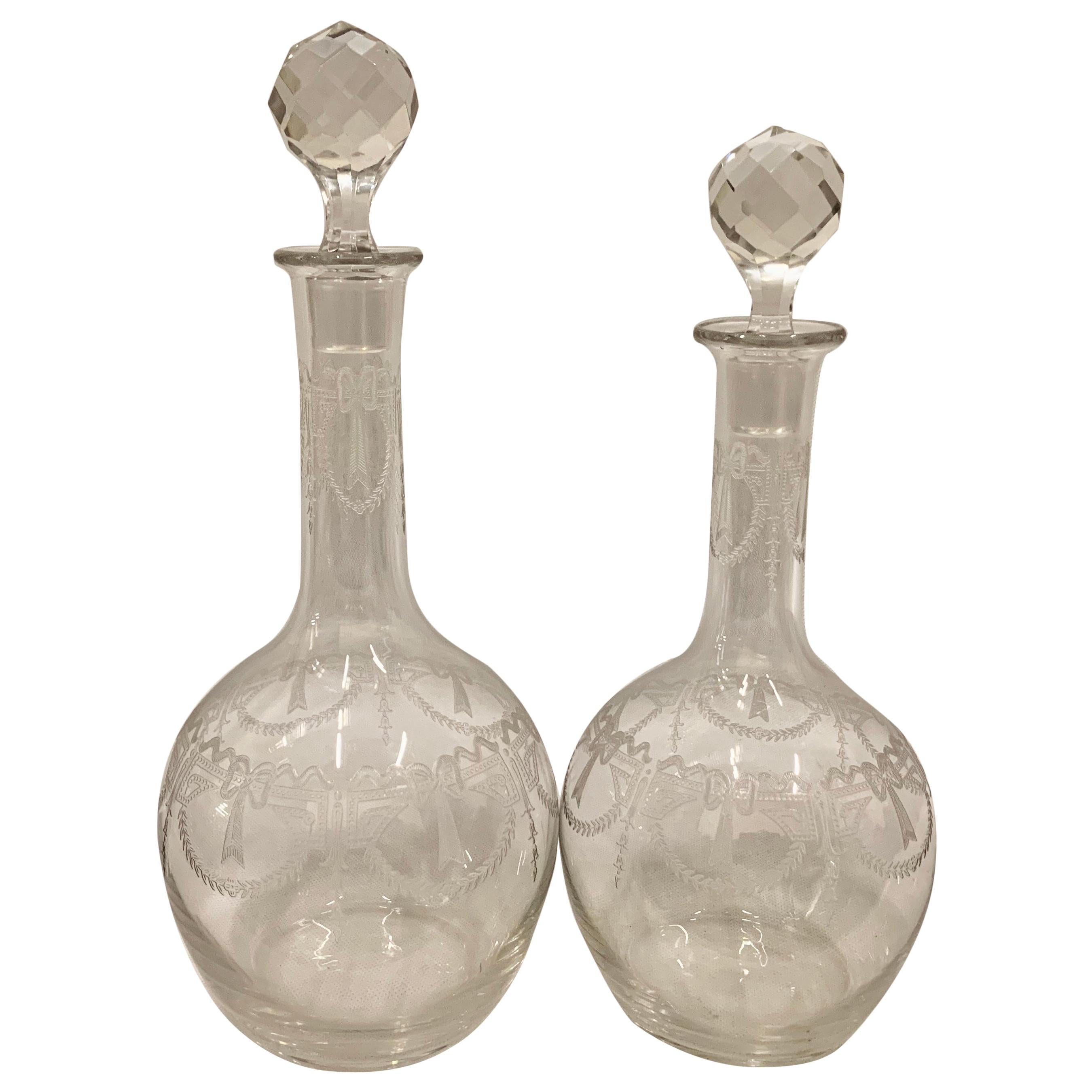 Set of Two French Crystal Decanters with Engraved Bodies and Faceted Stoppers